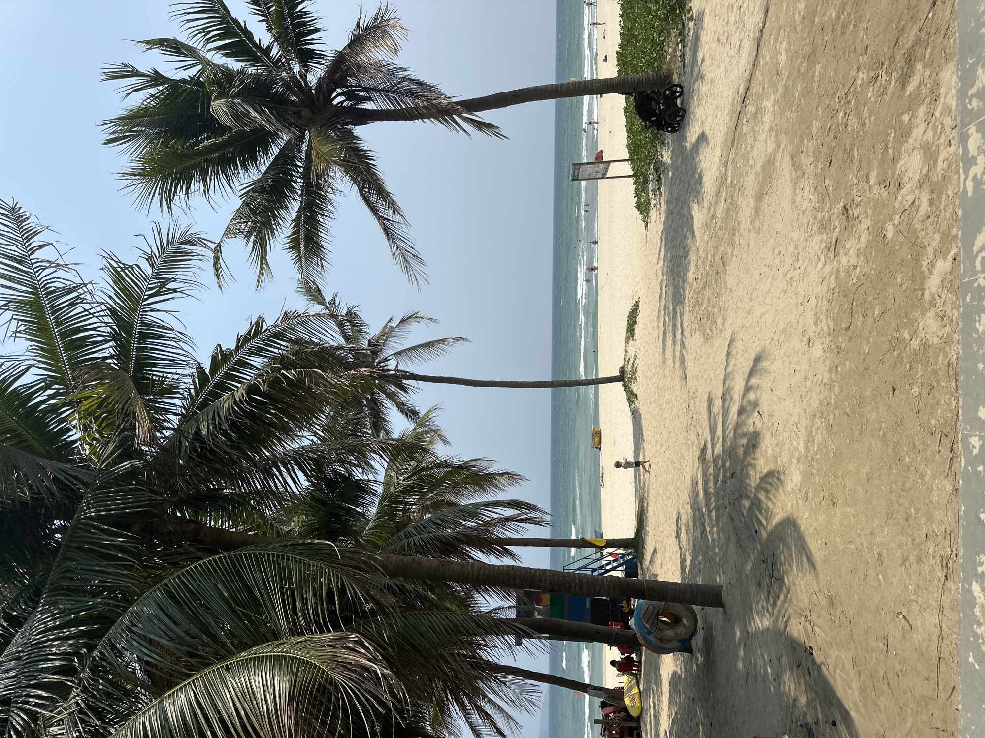 Early morning beach scene with swimmers in Đà Nẵng