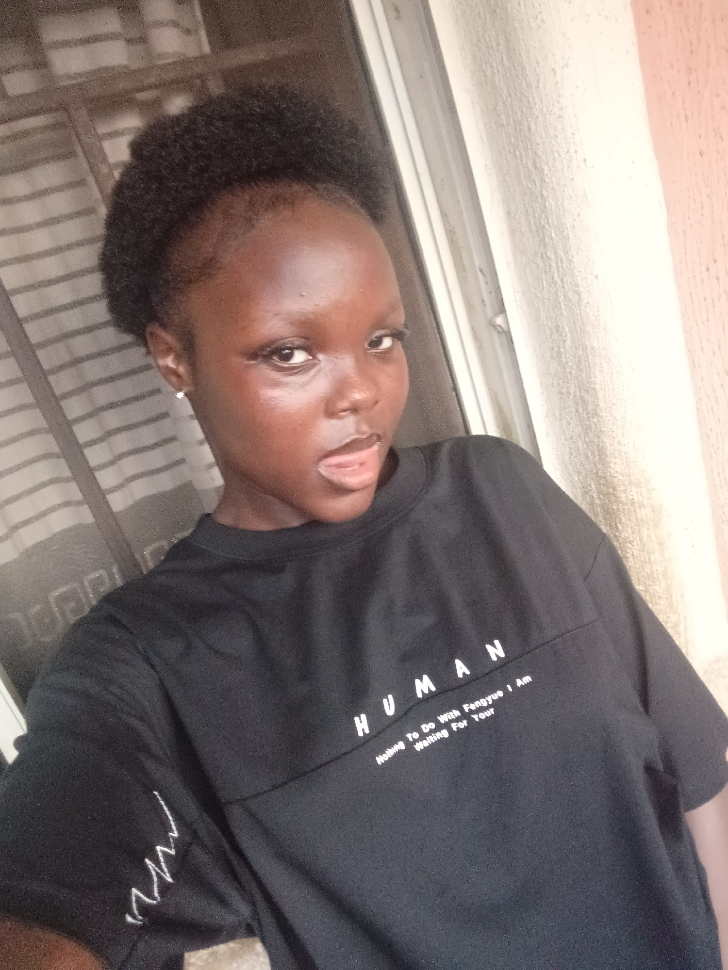 Woman documents casual Saturday afternoon in Onitsha, watches soccer