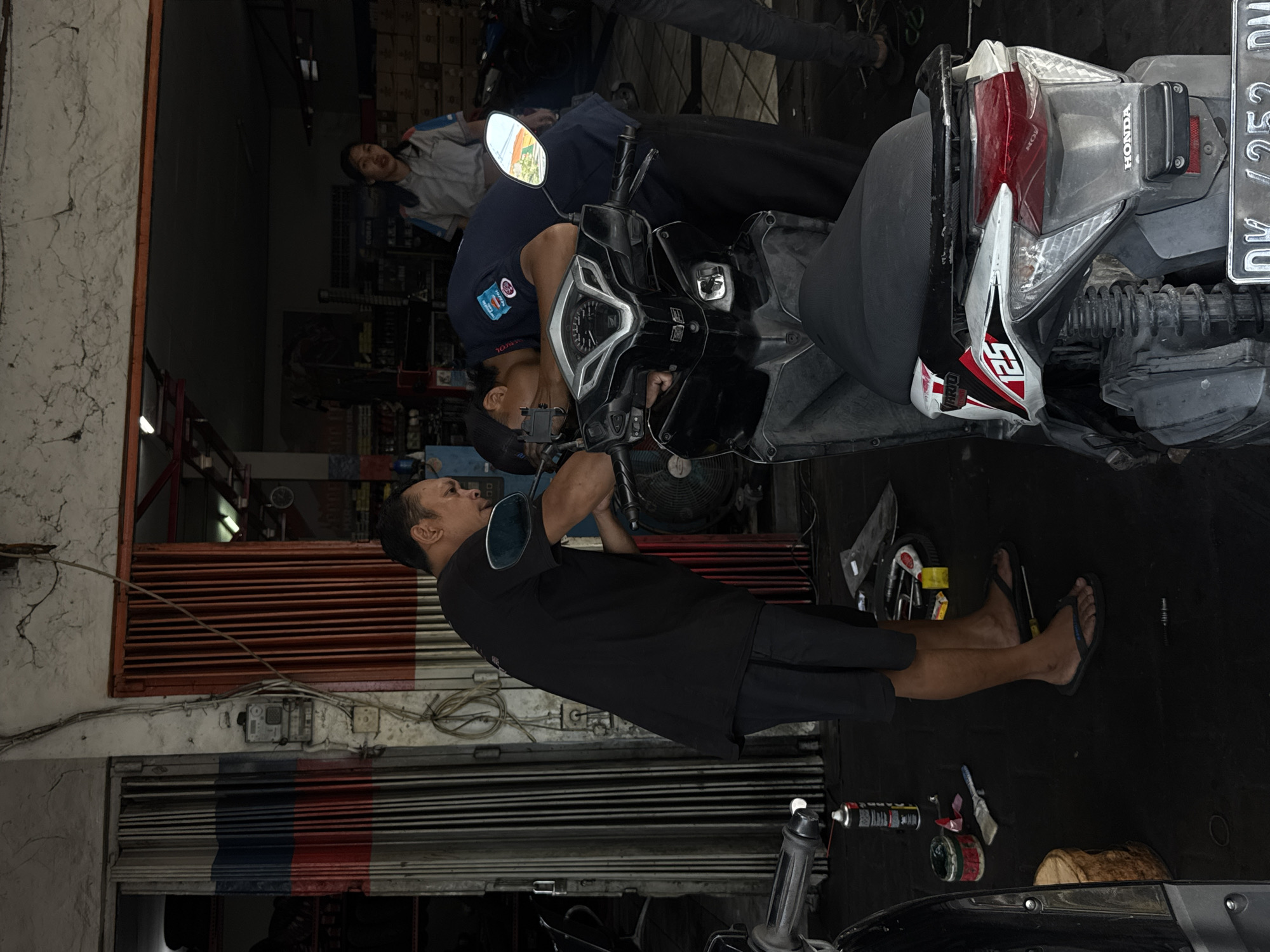 Motorcycle repair work underway in North Kuta shop