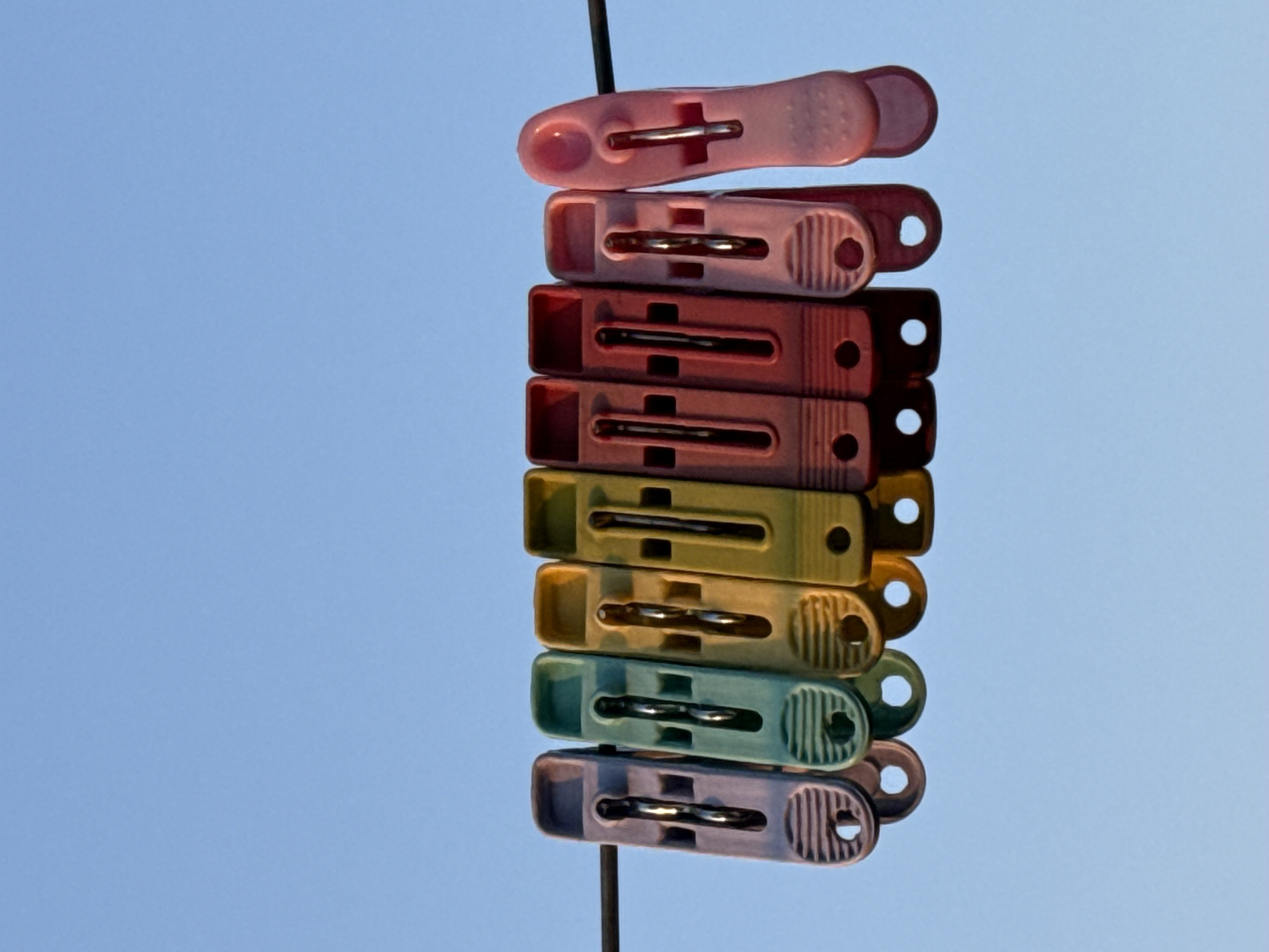 Colorful clothespins stacked on wire observed in Pokhara