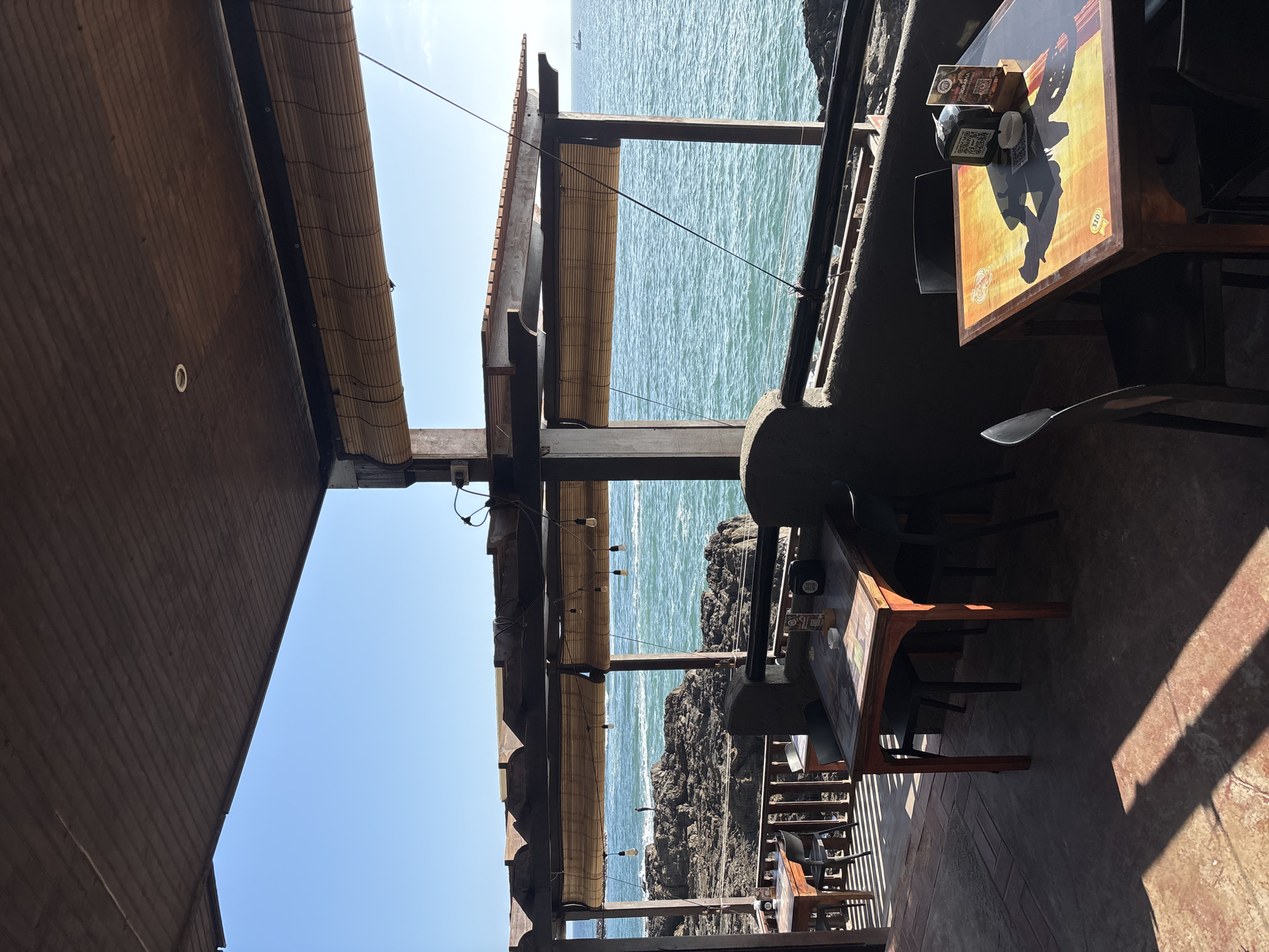 Cliff diving and dining captured at Arica's Pacific overlook