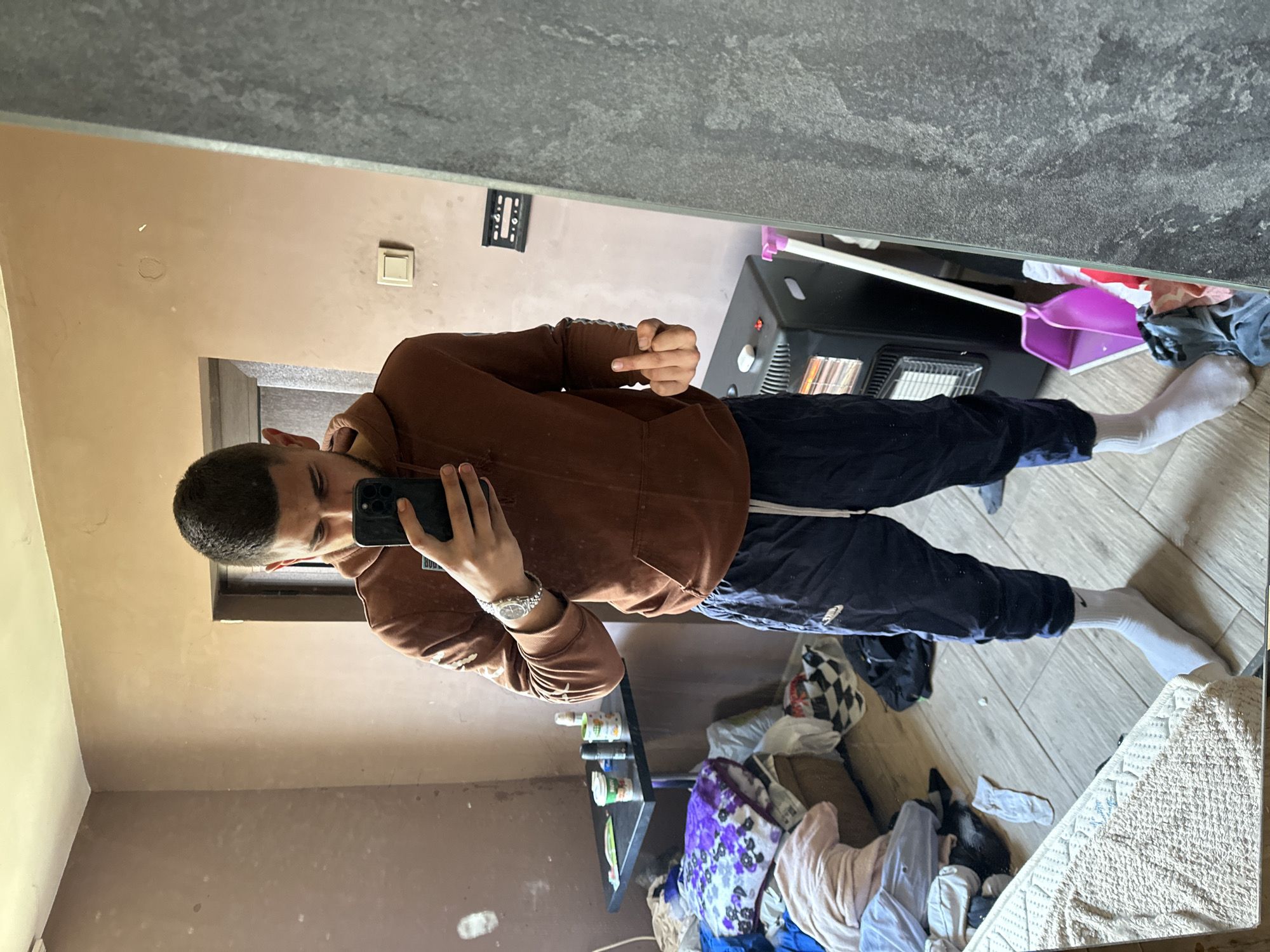 Man takes mirror selfie in Bulgarian home