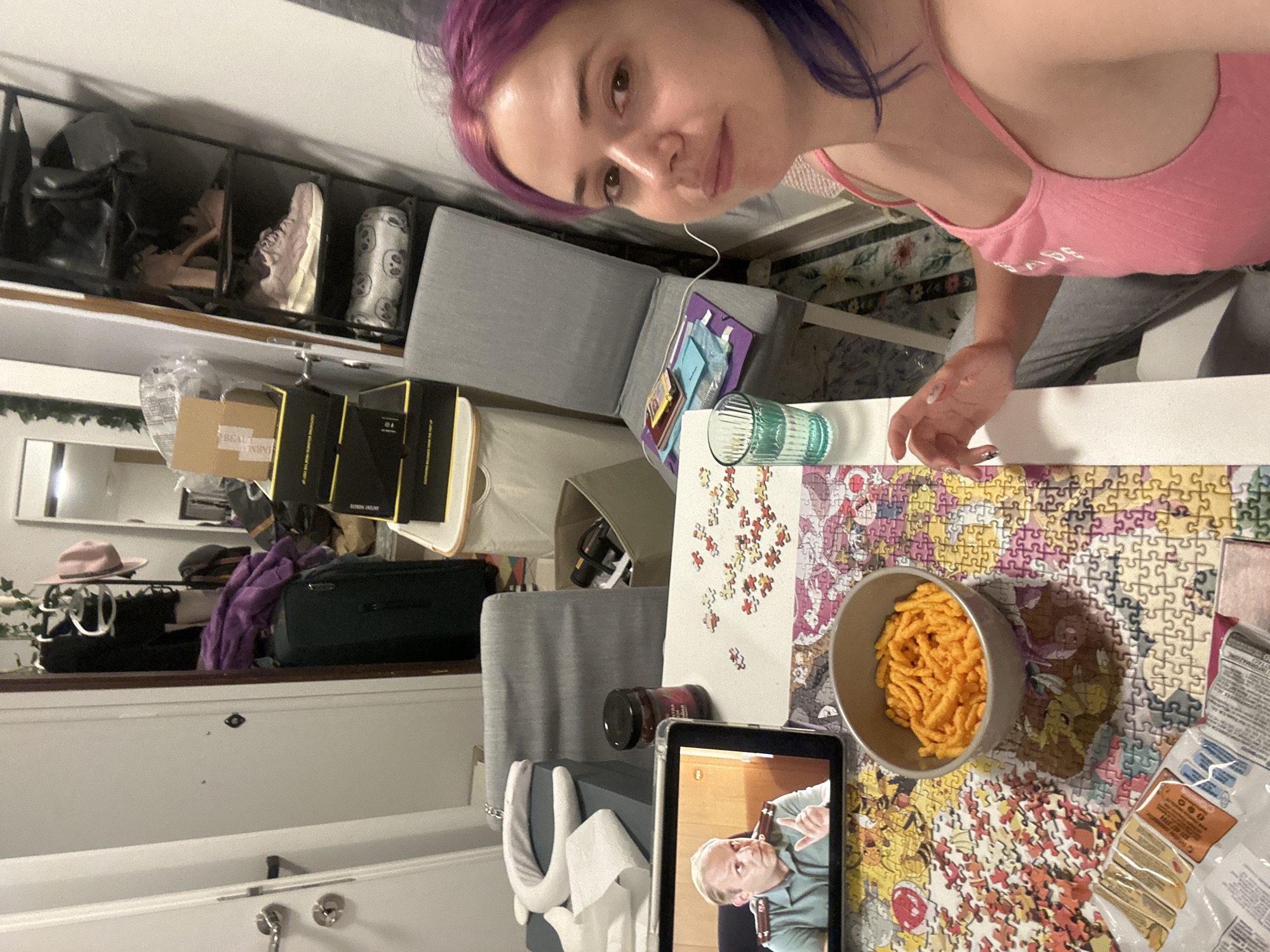 Woman enjoys puzzle and snacks in Zagreb evening scene
