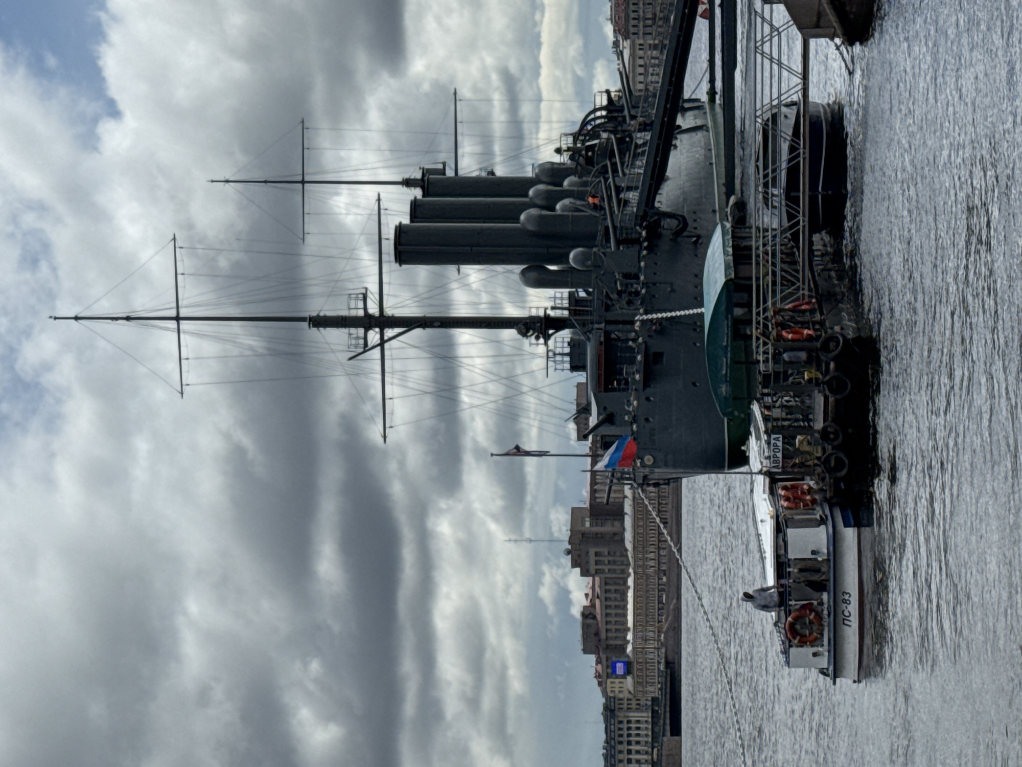 Tourists visit historic Cruiser Aurora along Saint Petersburg waterfront