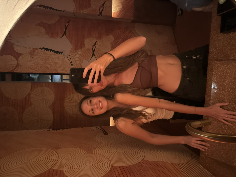 Two women capture mirror selfie in Tibubeneng, Indonesia