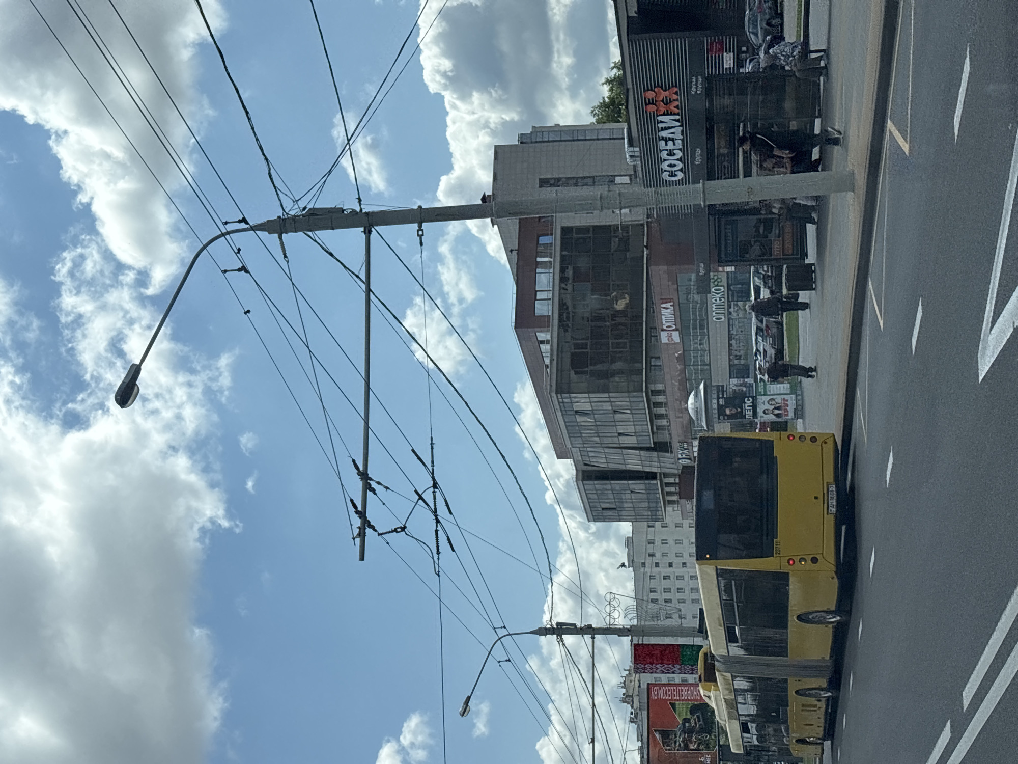 Yellow articulated bus on a Minsk city street