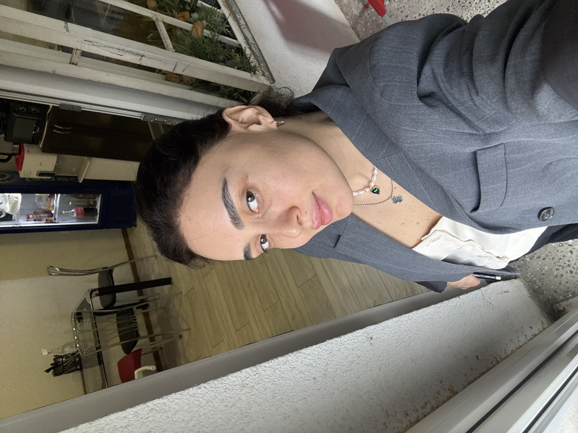 Woman photographed in multiple Tbilisi locations during morning hours