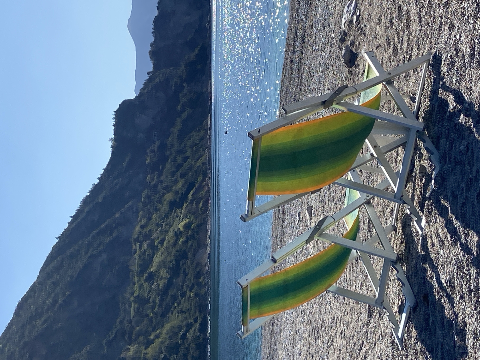 Beach chairs and tables set up on Montenegro coastline