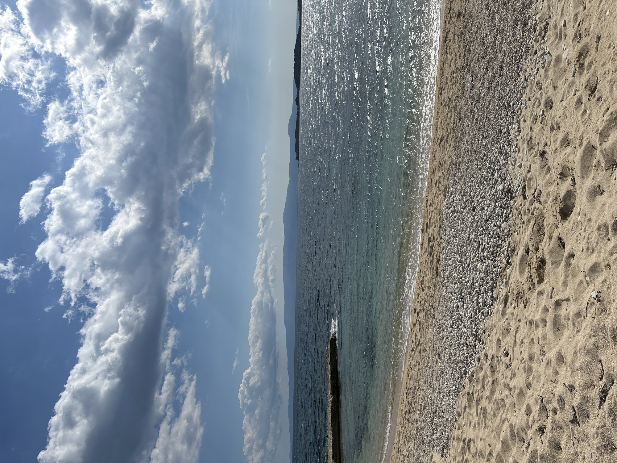 Tourist takes selfie at Greek beach in Ouranoupoli