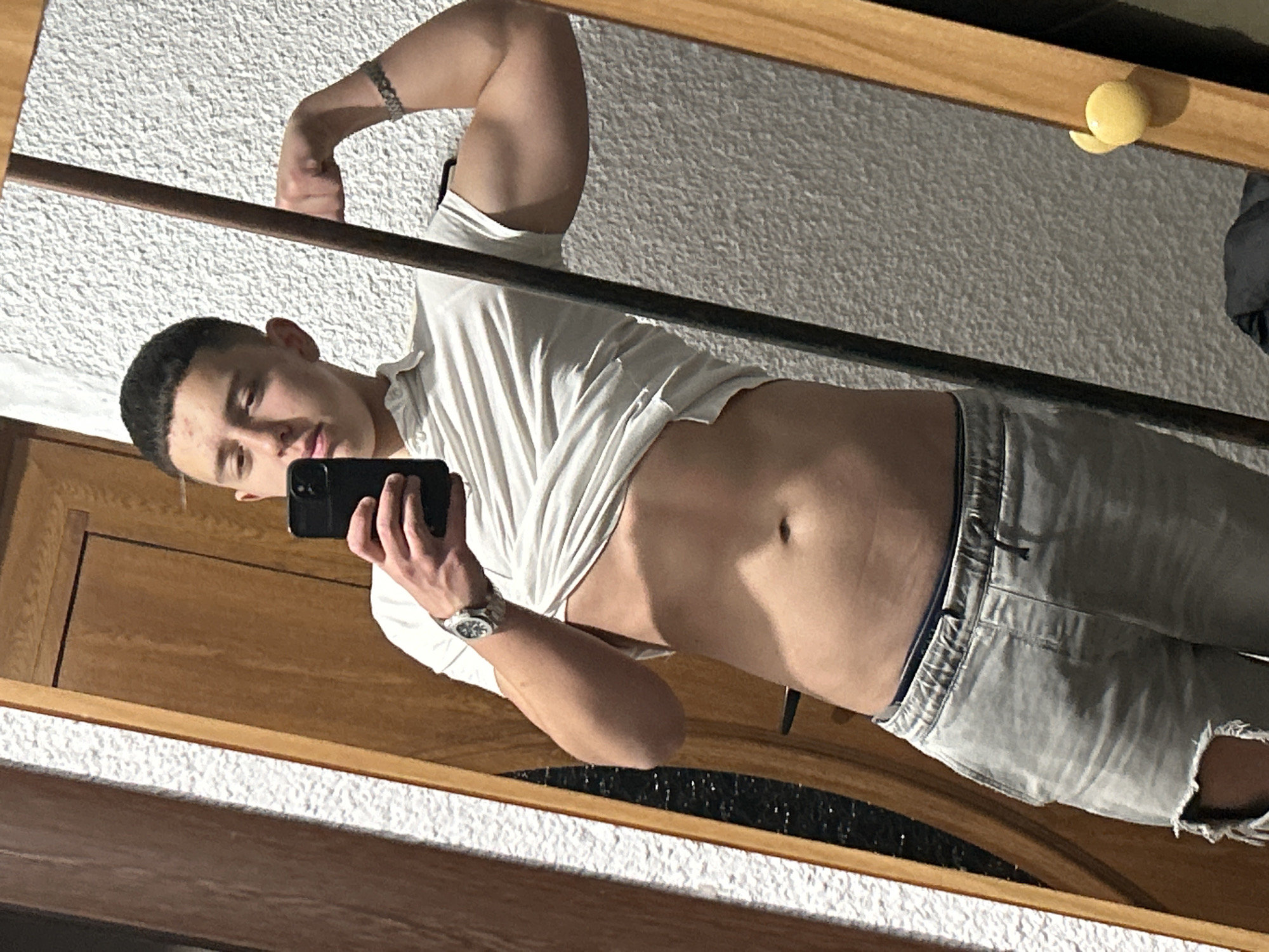 Young man takes mirror selfies in Zlatograd apartment