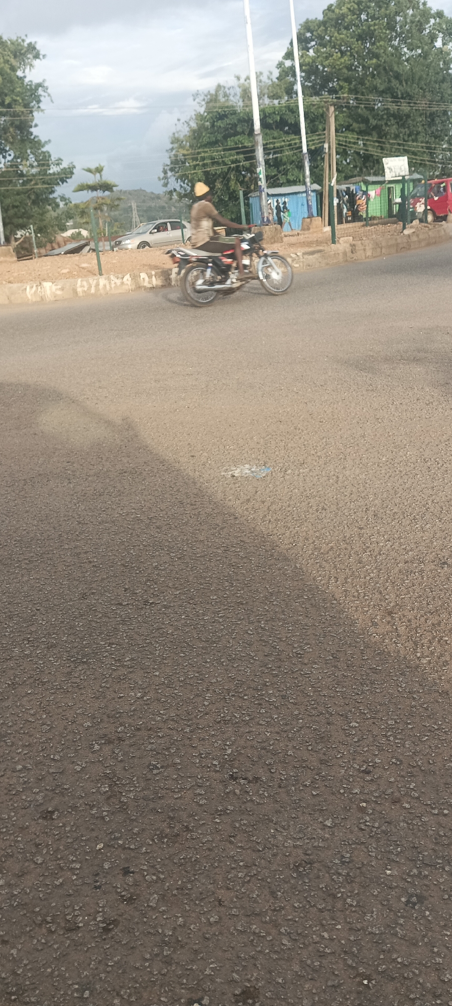 Evening street life documented in Bukuru, Nigeria