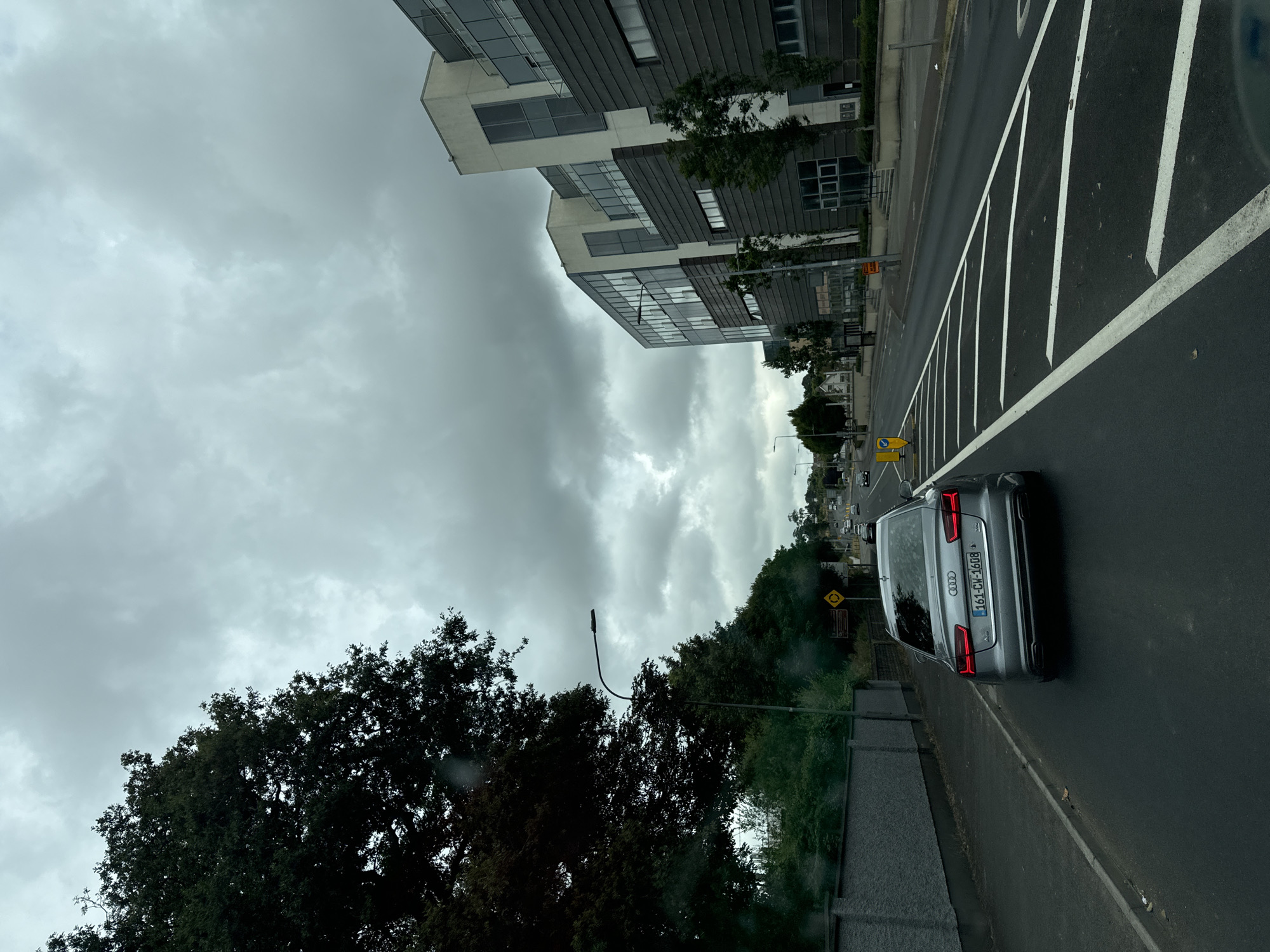 Grey Audi A6 on a wet Waterford road, cloudy afternoon