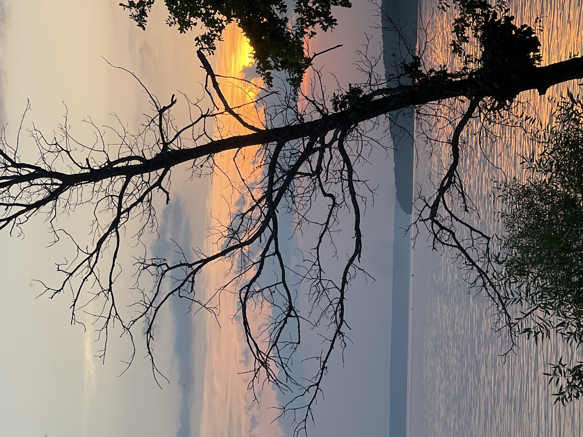 Sunset over a quiet lake near Leninka, Russia