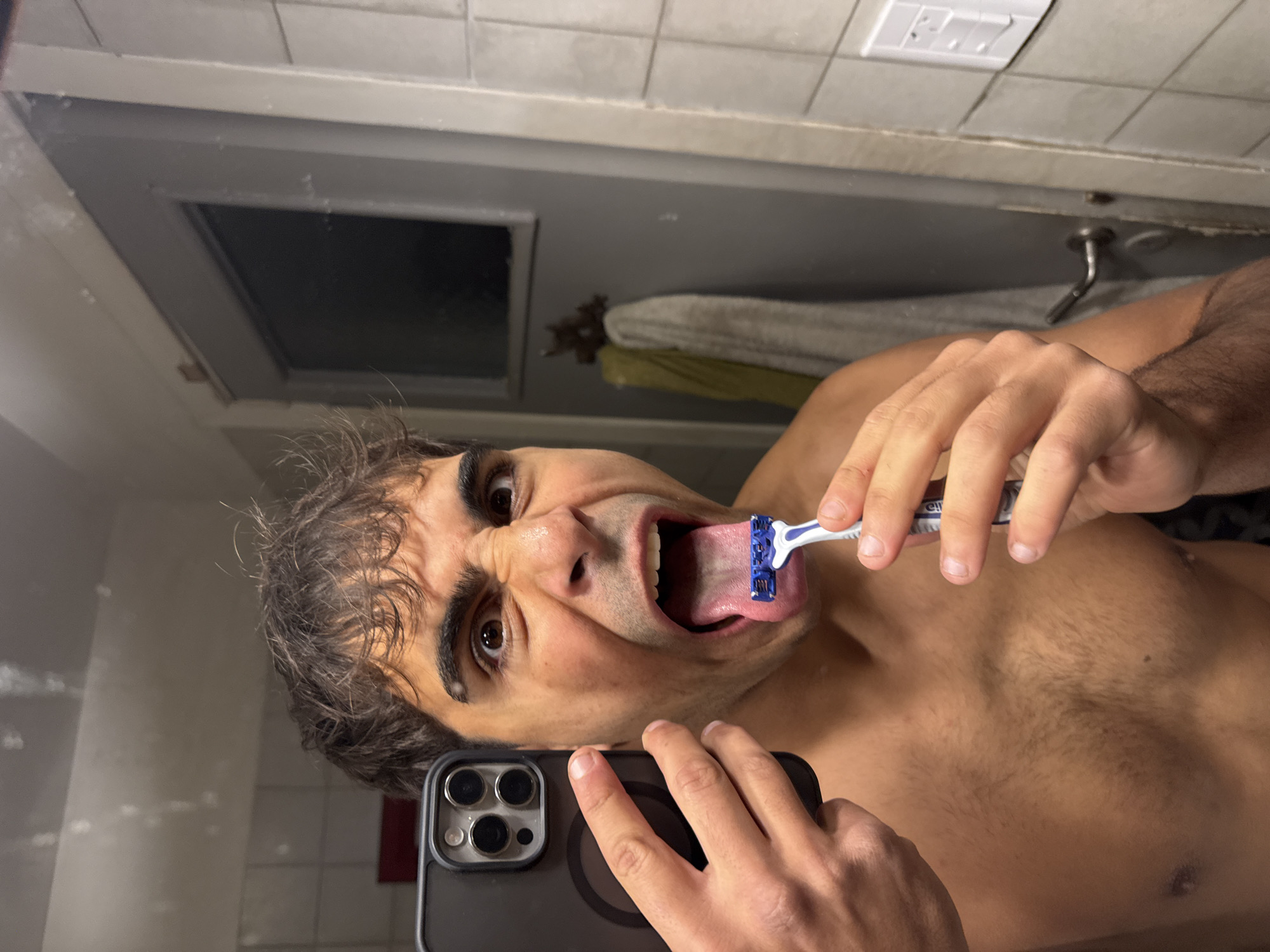 Late-night bathroom selfie session captured in Avellaneda, Argentina