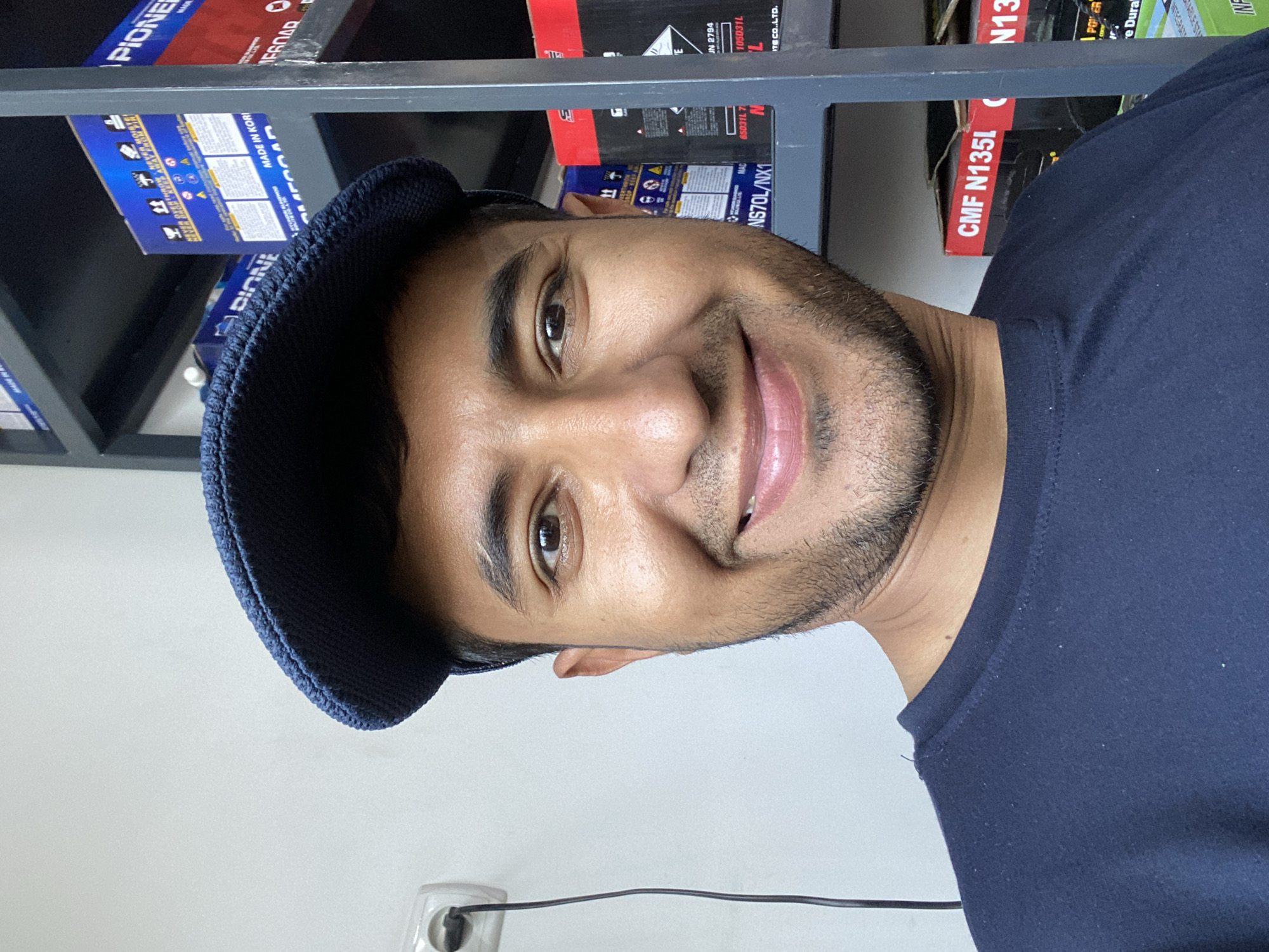 Man takes selfies at automotive store in Bukhara