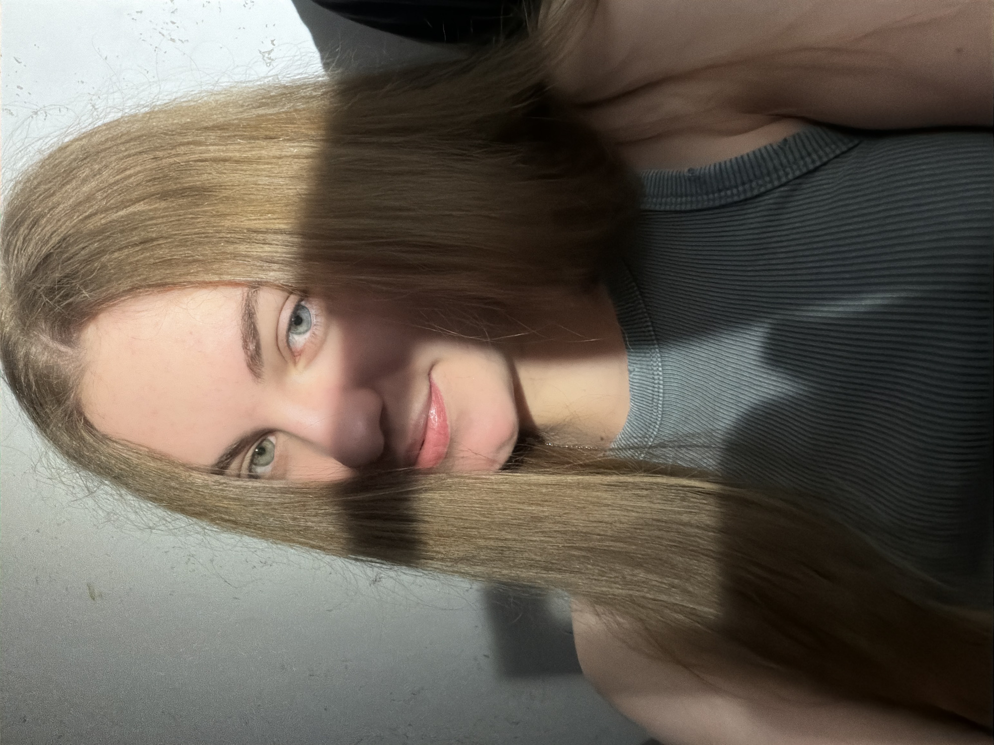 Moody self-portrait session with dramatic lighting and direct gaze