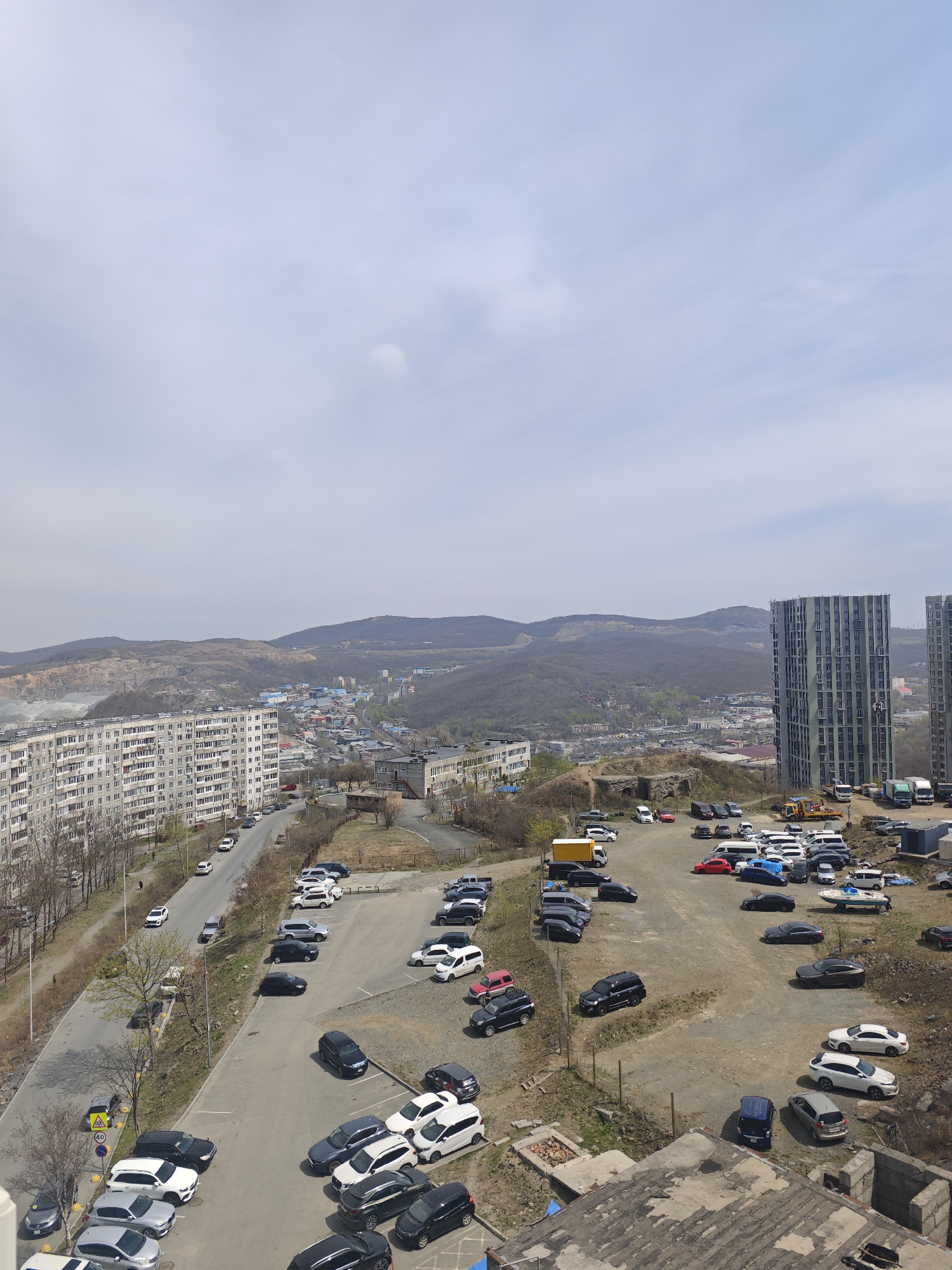 Elevated cityscape view documented in Vladivostok under overcast conditions