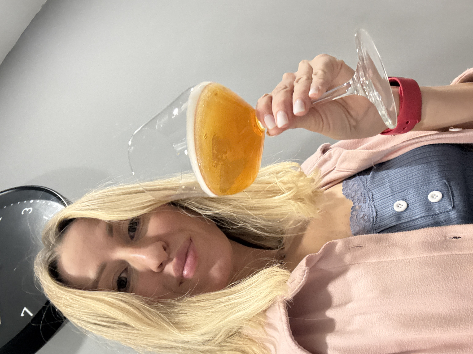 Woman enjoys beer indoors in València