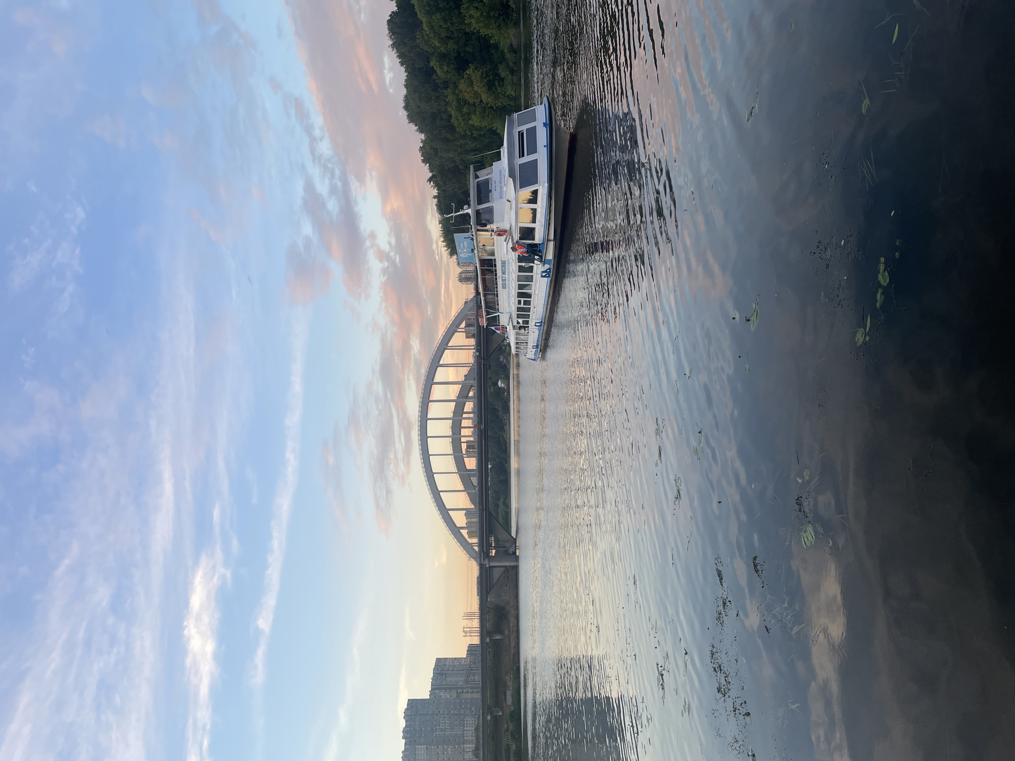 Passenger boat cruises the Khimki Reservoir near Moscow Canal
