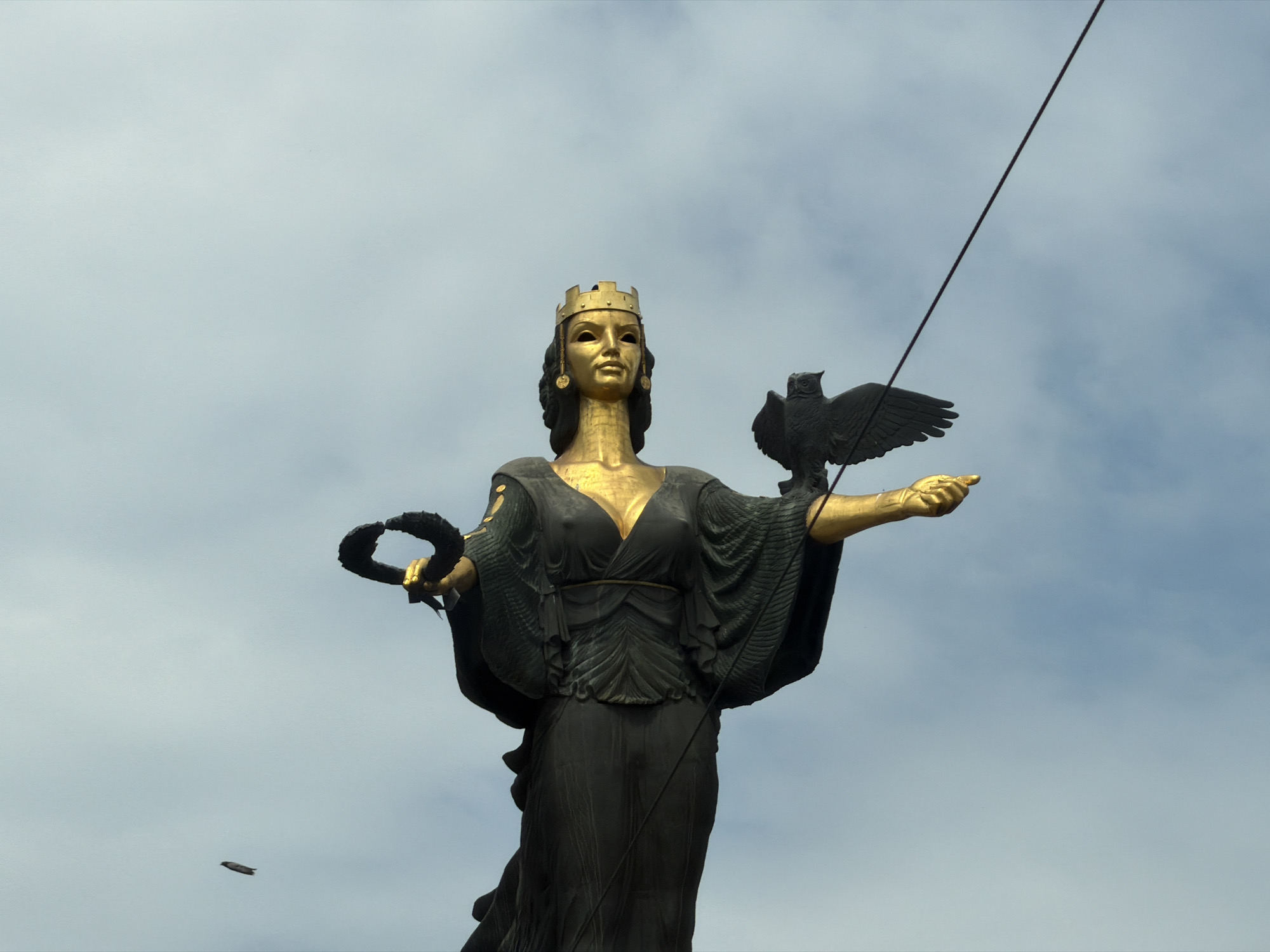 Sofia street scenes: statue, blooming gardens, and a Costa Coffee