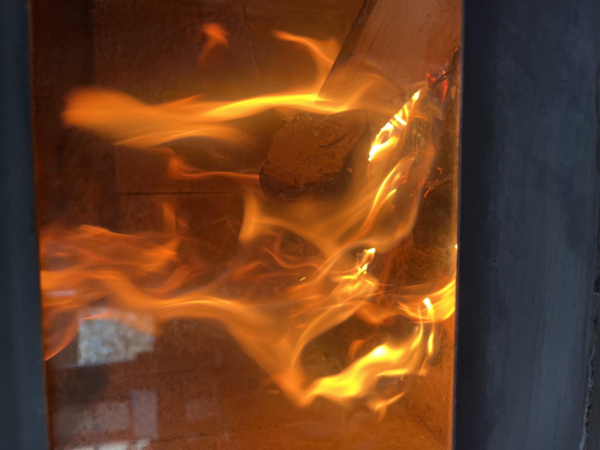 Wood-burning stove operates in Pchelnik, Bulgaria morning hours