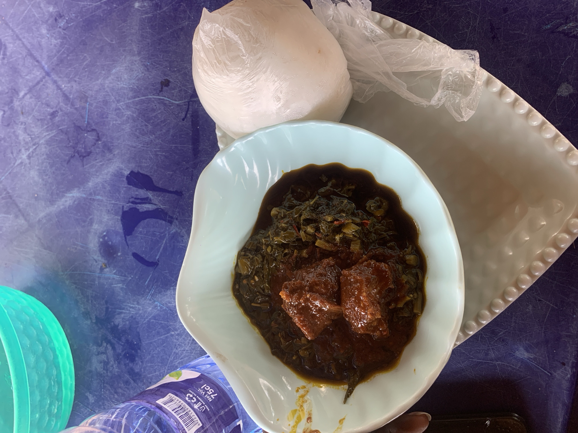 Food and everyday life around a thatched shelter in Jalingo