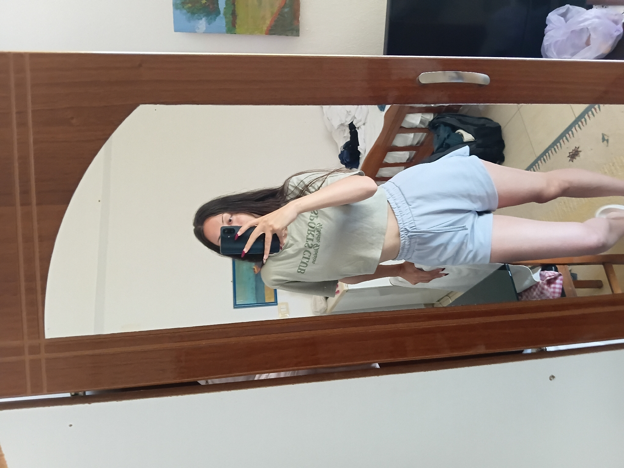Woman takes morning selfies in Vlora, Albania residence