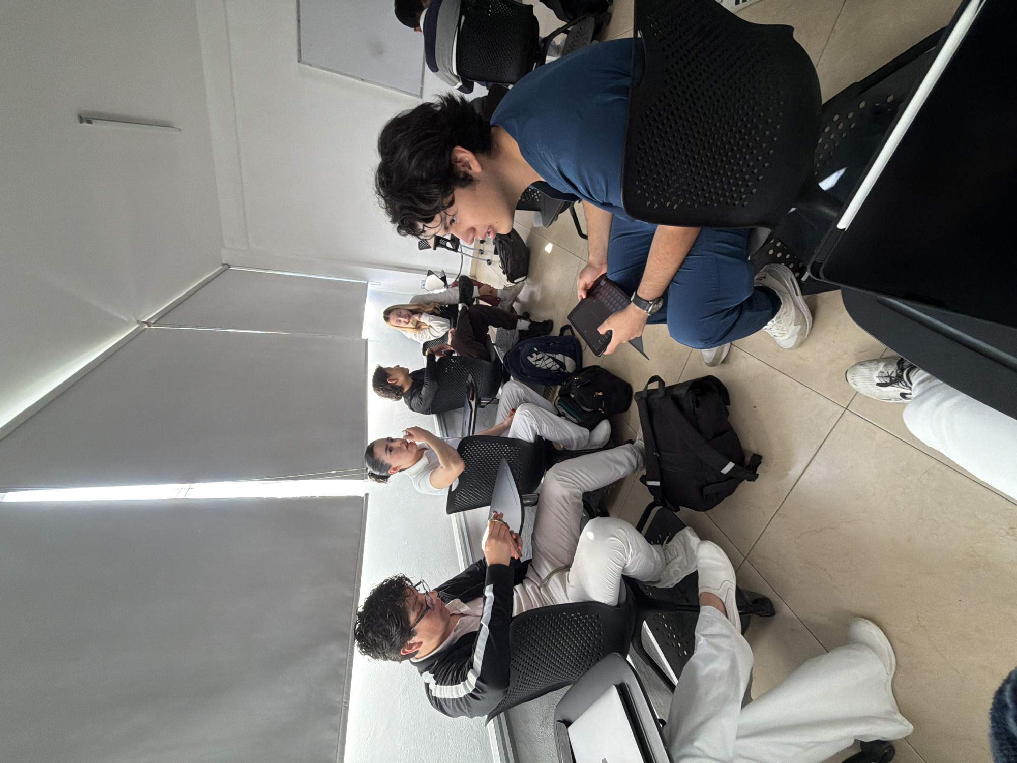 Young adults gathered in indoor space in Puebla