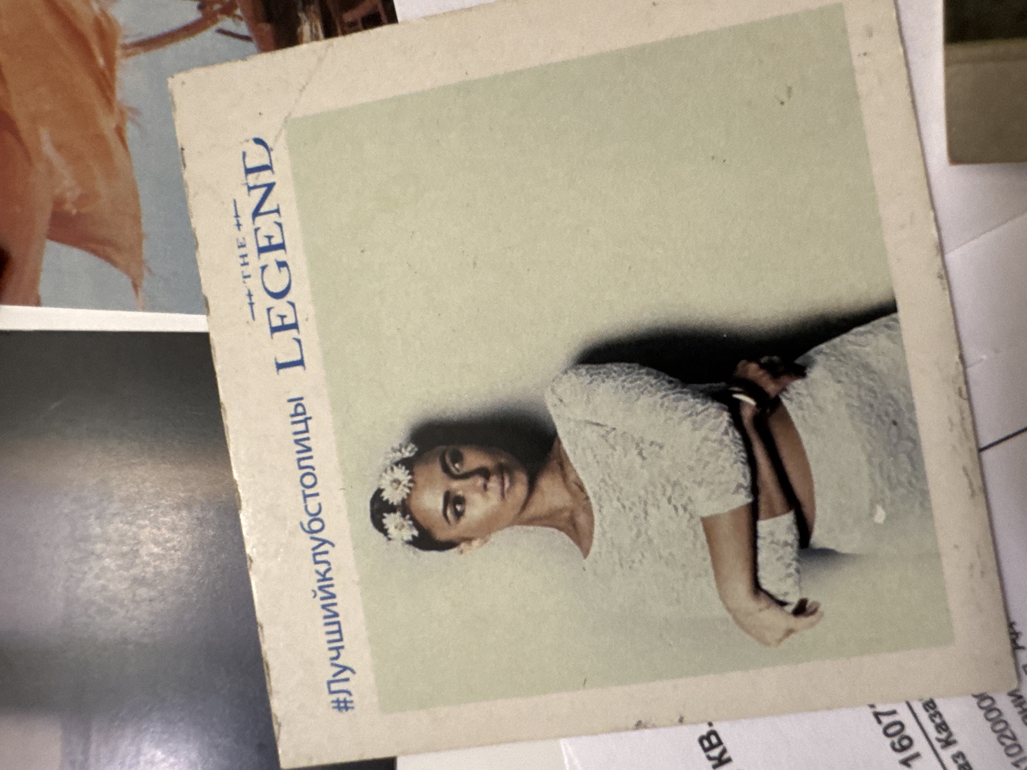 Woman's photo with flowers displayed among papers in Kazan
