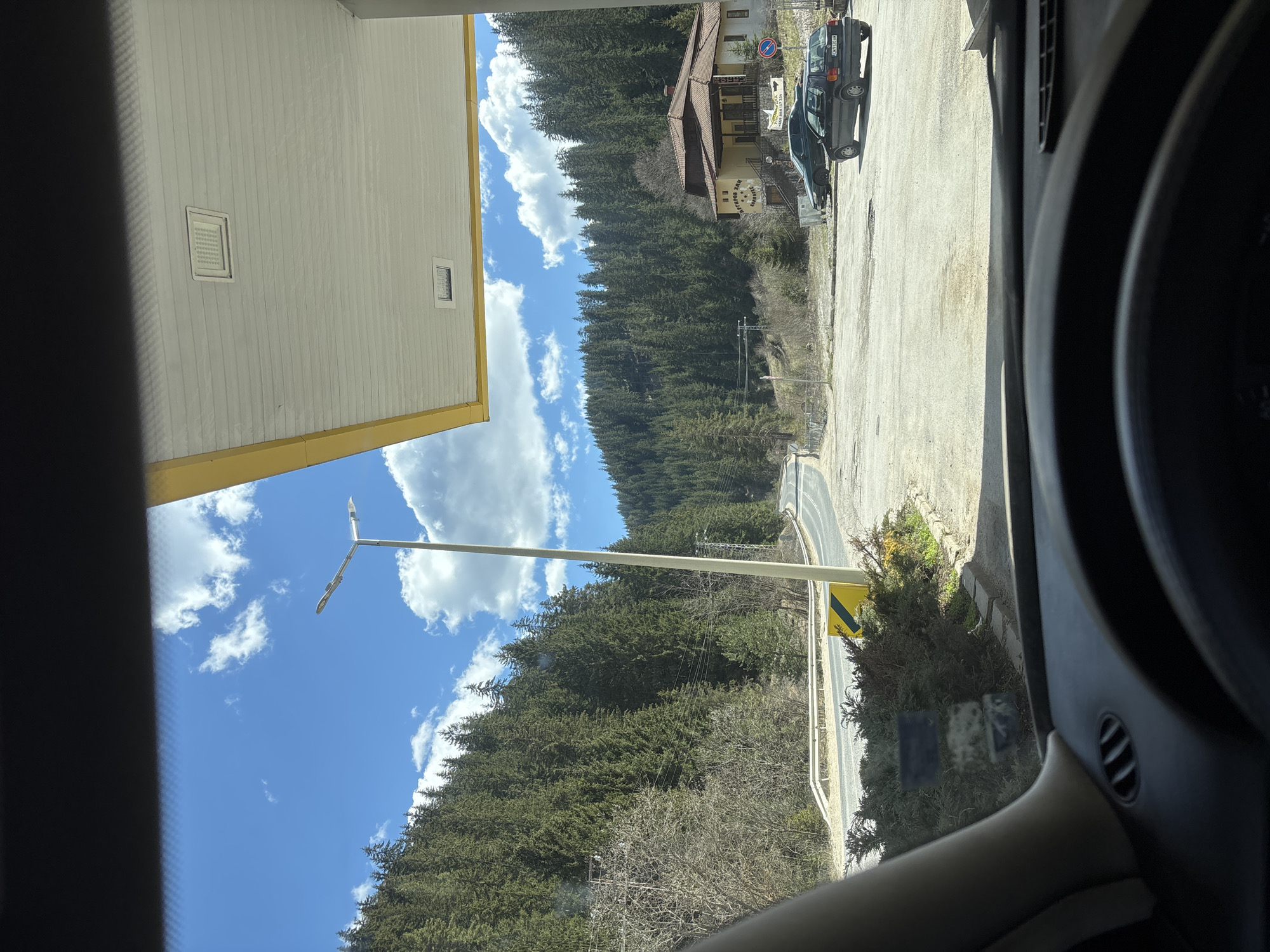 Driver documents street view in Chepelare, Bulgaria