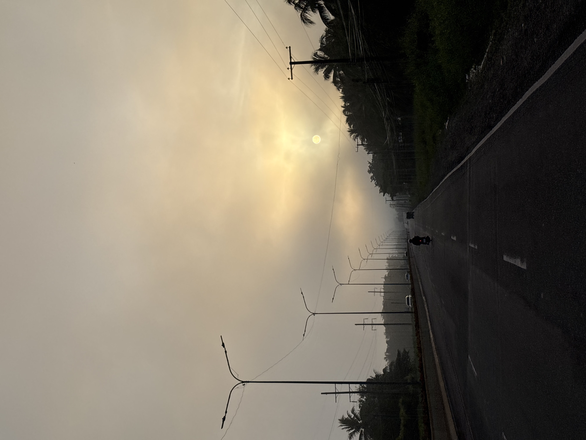 Hazy road scene at golden hour, Carmen, Philippines
