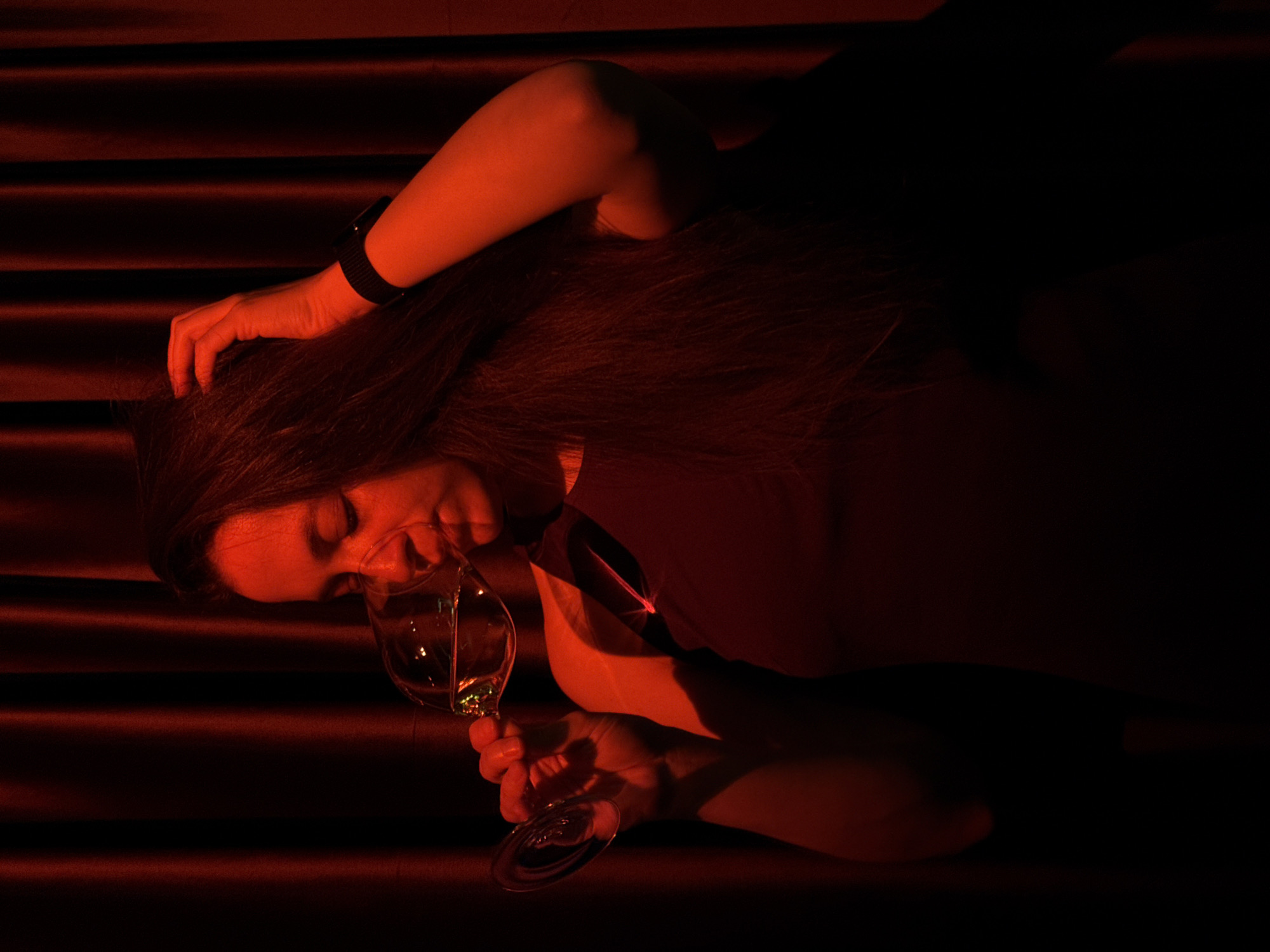 Woman relaxes with wine in atmospheric Moscow venue