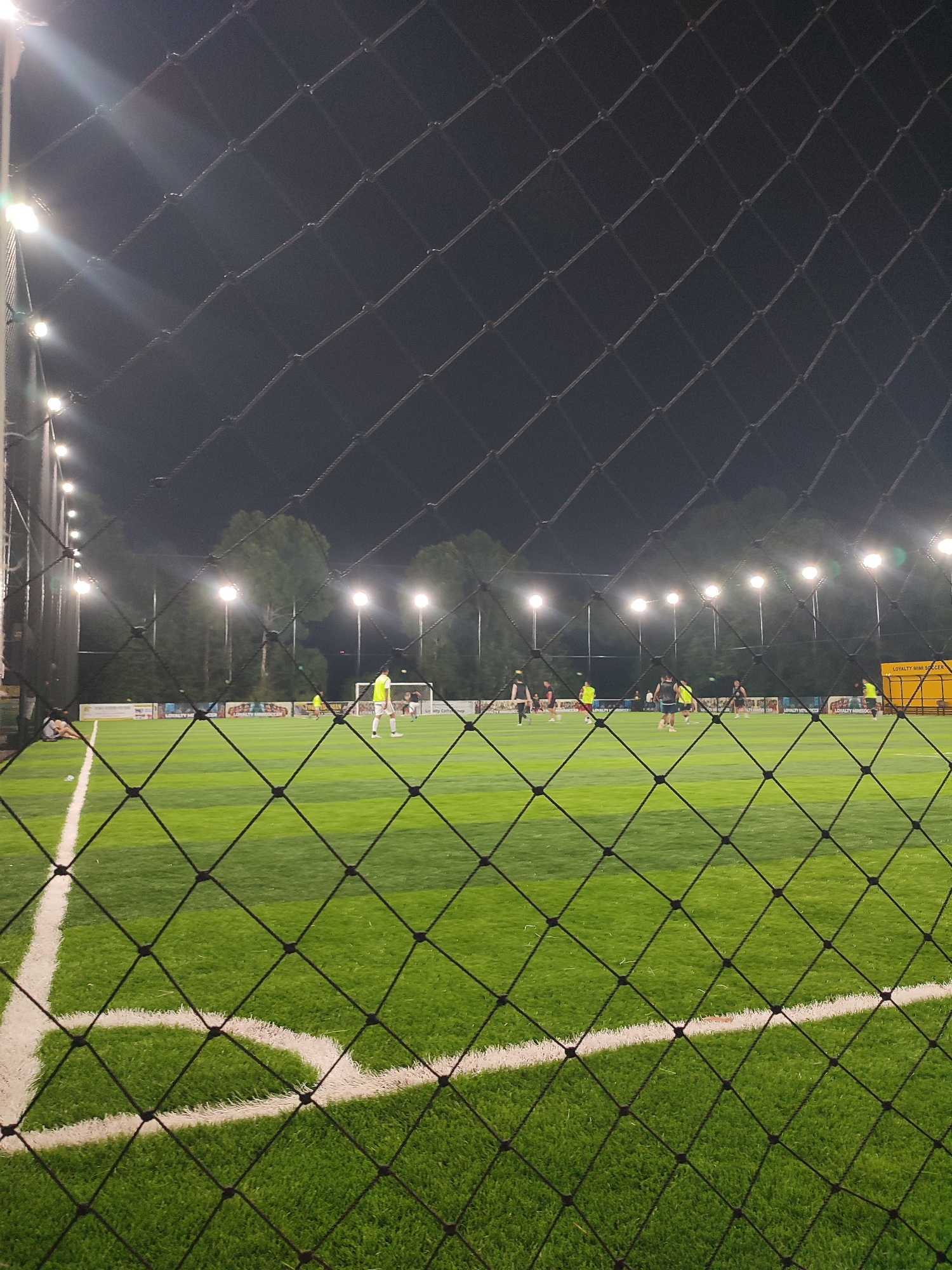 Evening soccer match draws players to lit Titibaro field