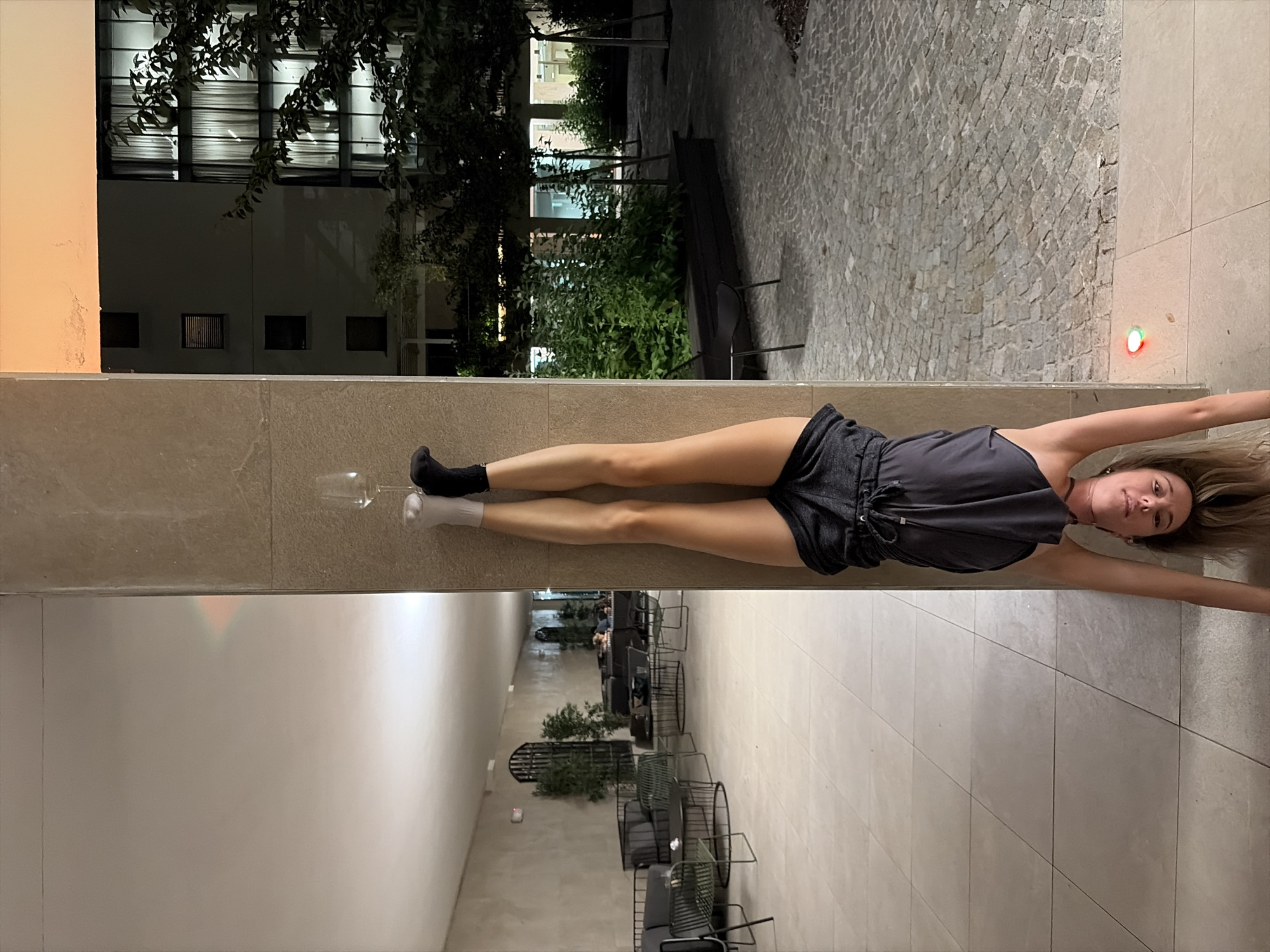 Milan evening: wine glasses, handstands, and sofa acrobatics