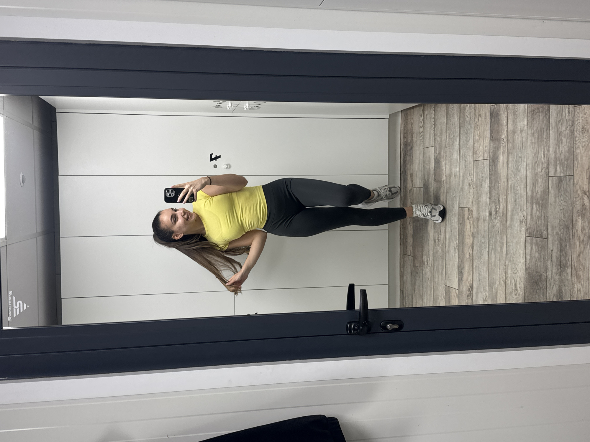 Woman photographed in changing room, later on floor in Pernik
