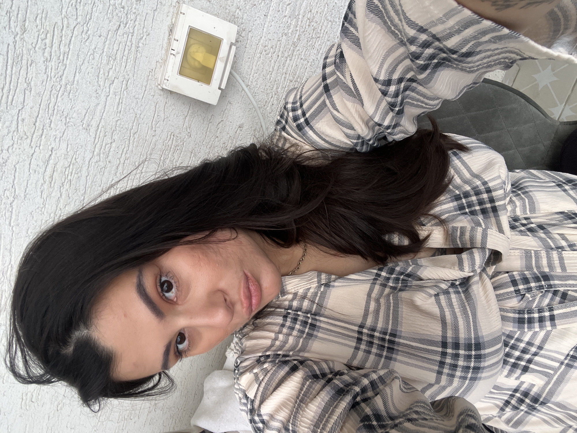 Woman photographed in plaid shirt at Kiryat Bialik residence