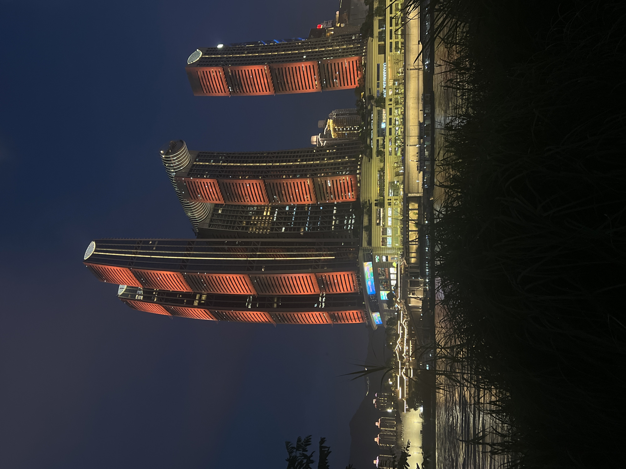 Chongqing's Yuzhong District riverfront glowing on a summer night