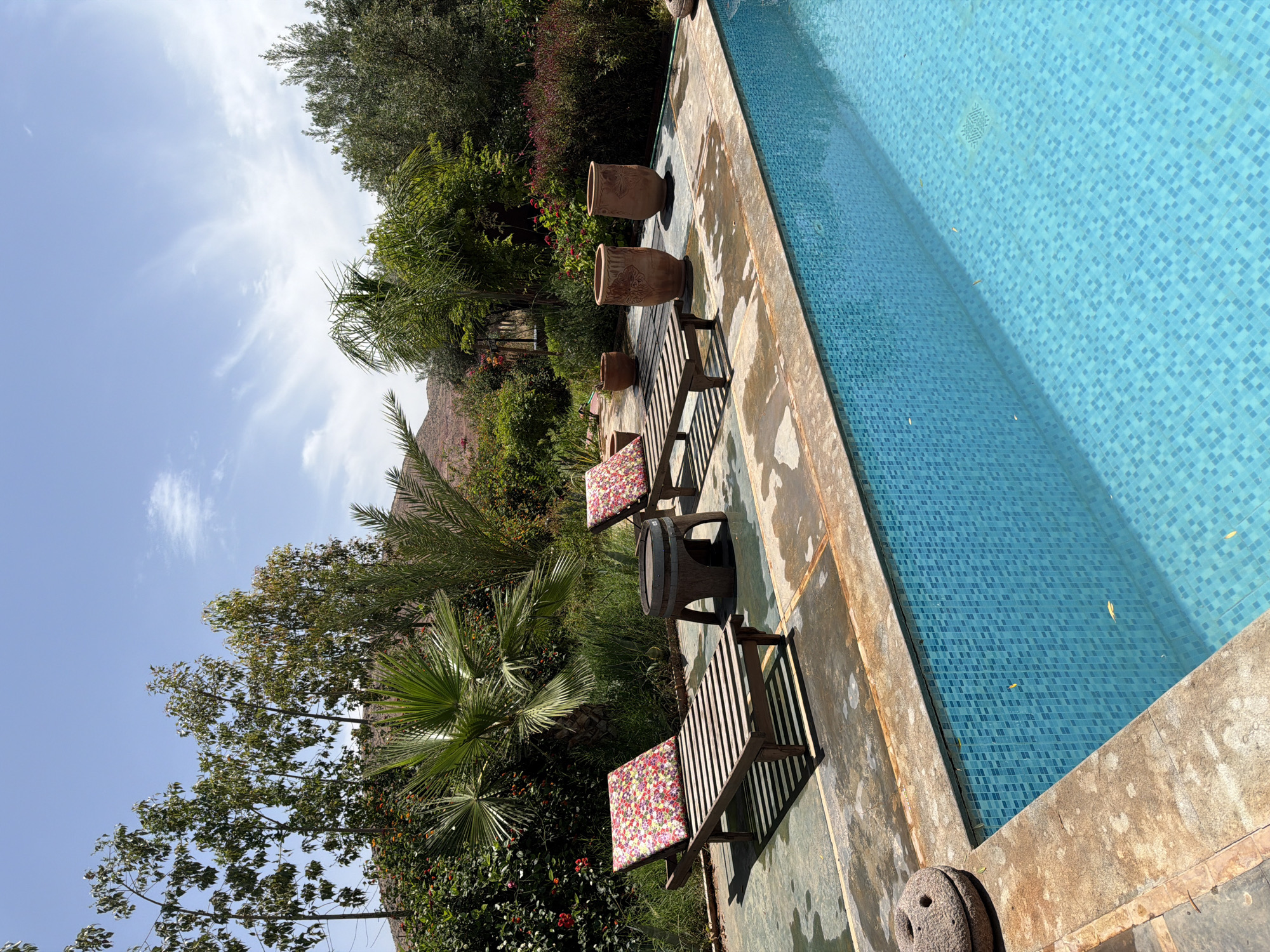 Tourist documents poolside resort and traditional crafts in Tahannaout