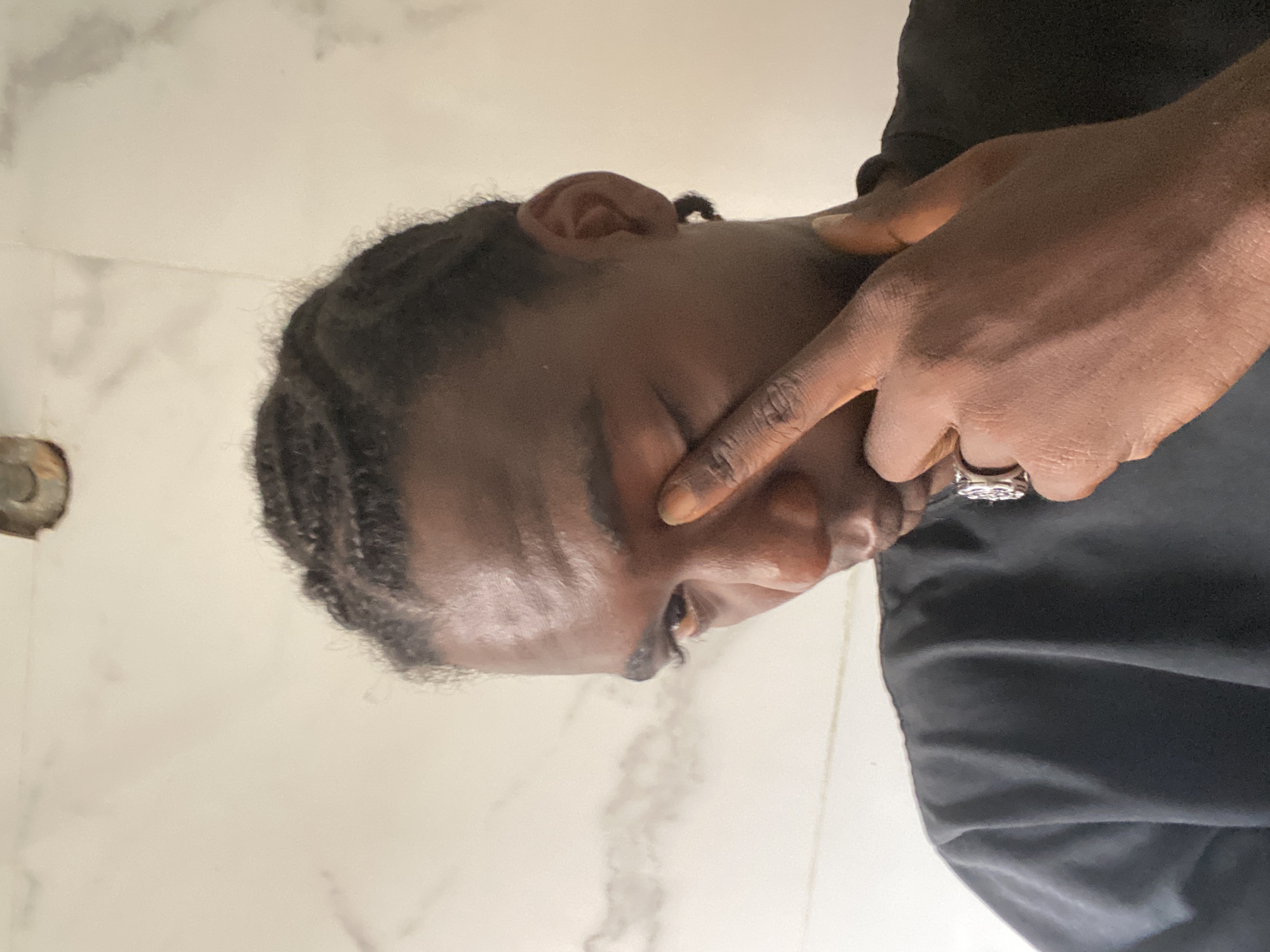 Person photographed multiple times in Lagos indoor setting