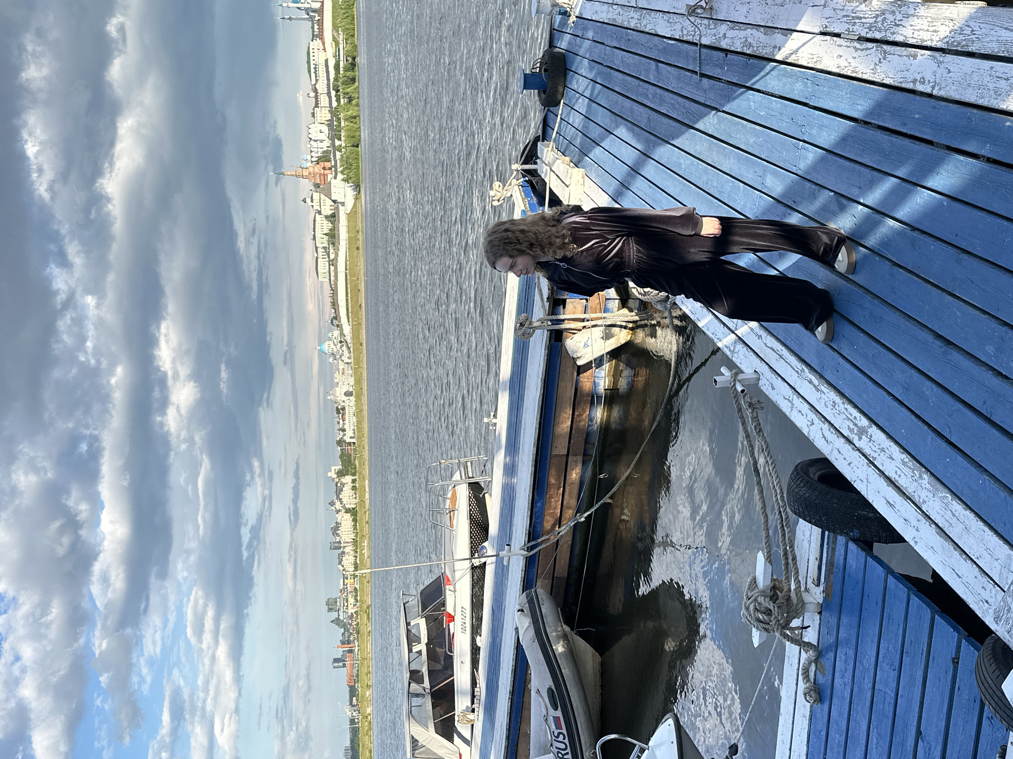 Woman spends afternoon at Kazan riverside marina dock