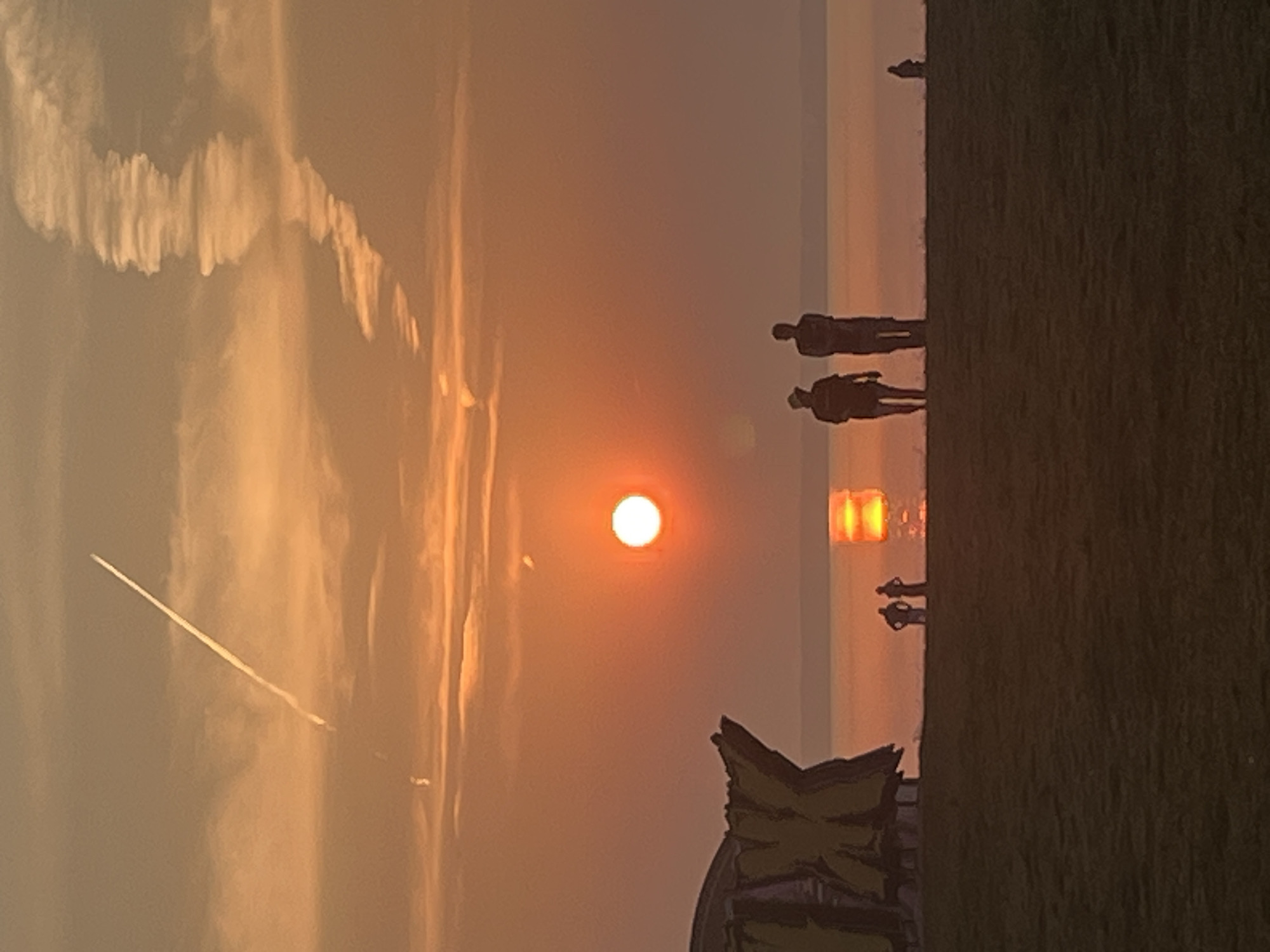 Sunset beach festival setup on the Surakovo shoreline