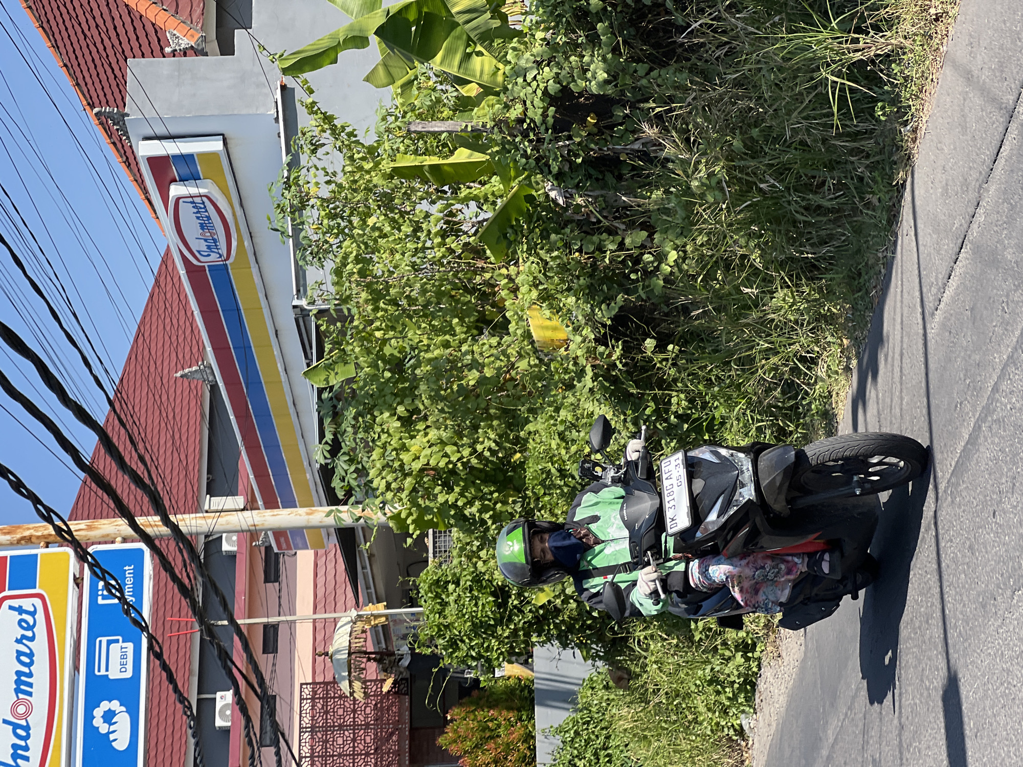 Morning motorcycle traffic observed on Denpasar roads