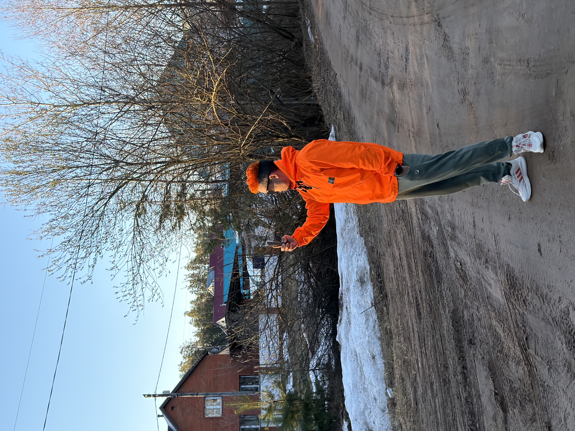 Adult and children spend time on dirt roads in Chaikovsky