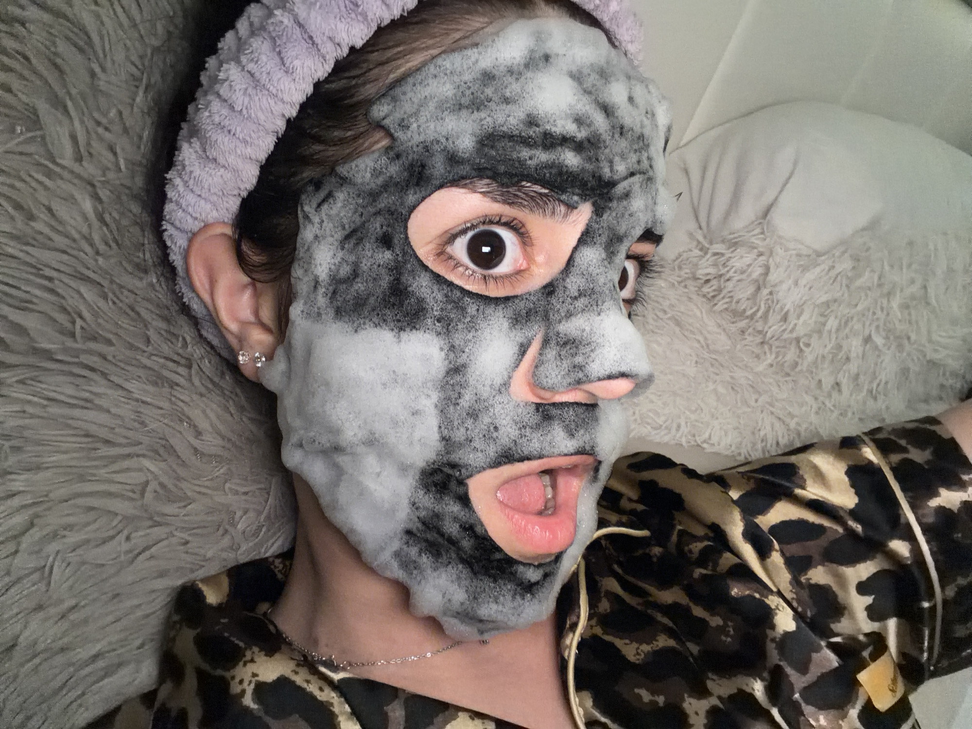Person applies facial mask at Sofia residence during evening