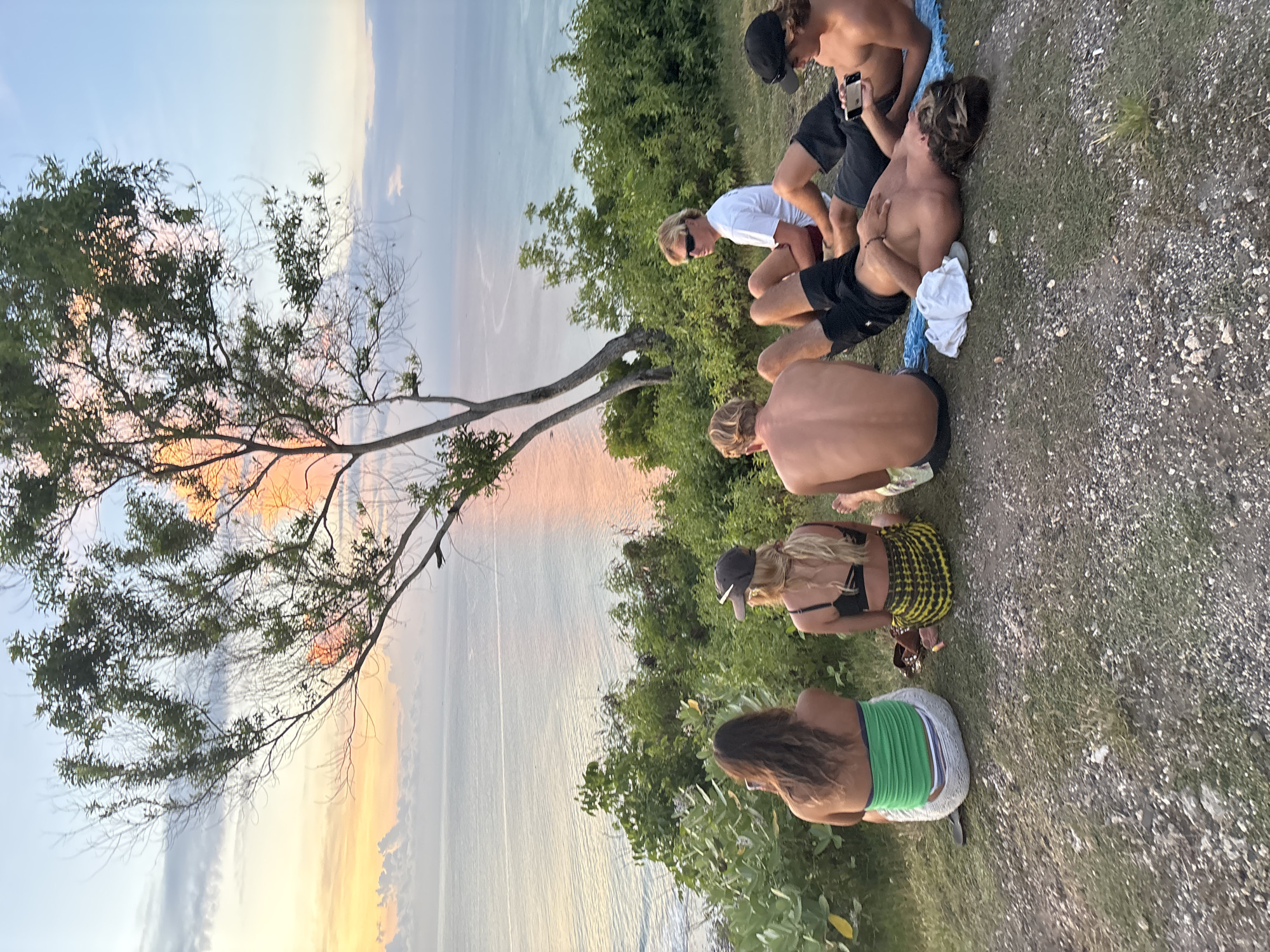 Seven youth gather for clifftop sunrise viewing in Kuta Selatan