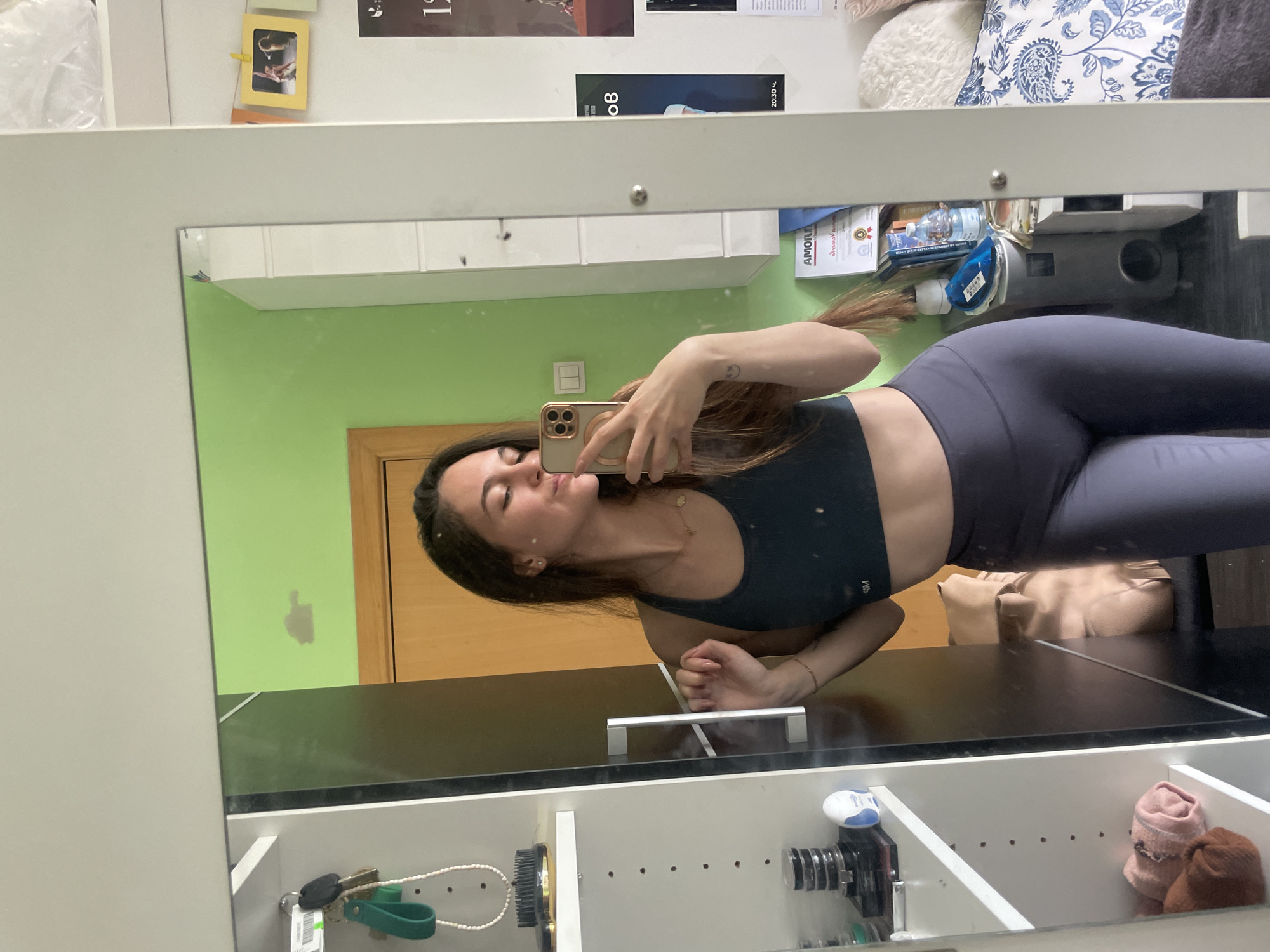 Woman takes mirror selfie in athletic wear in Sofia