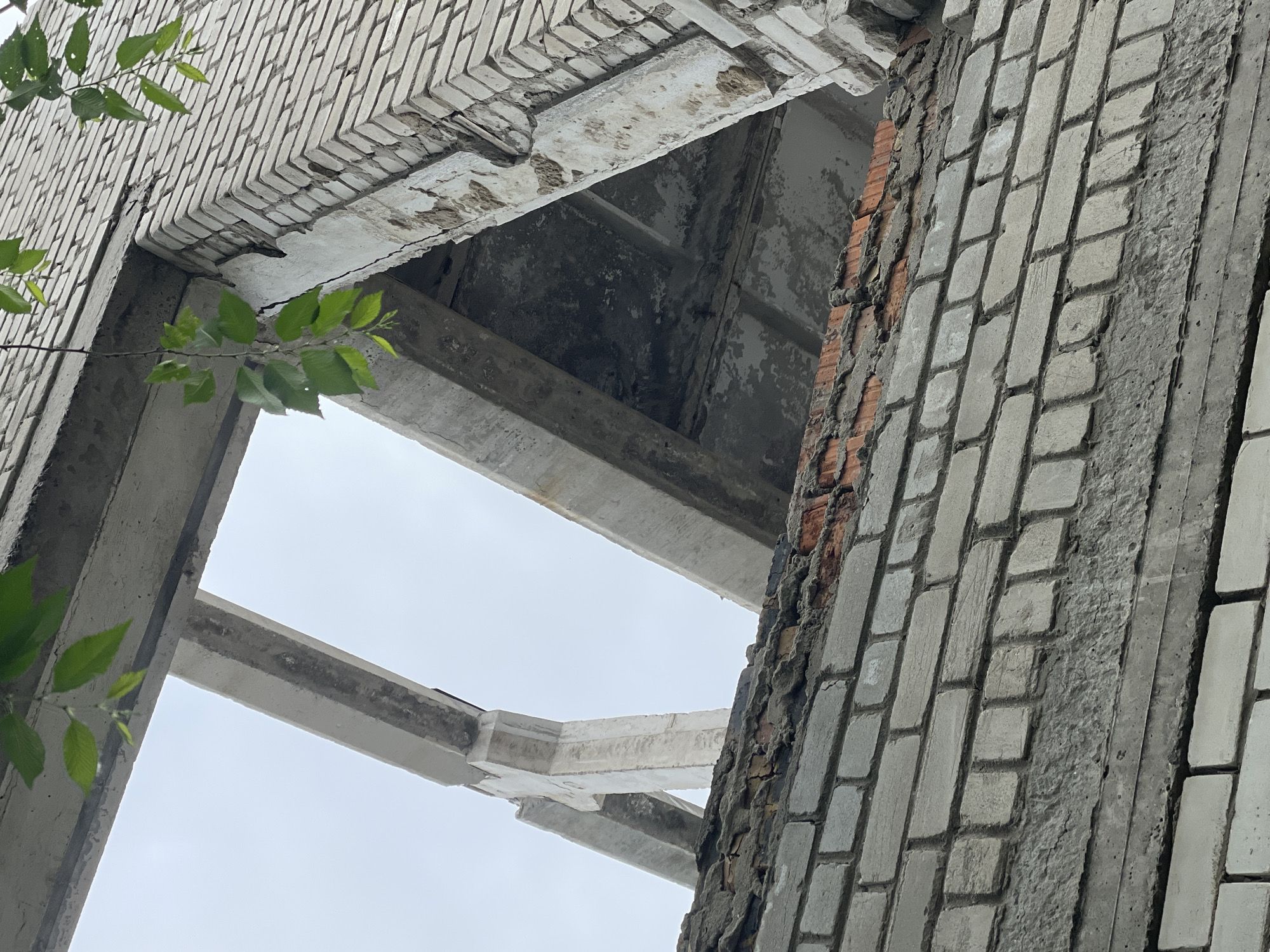 Abandoned building's decaying interior captured in upward view
