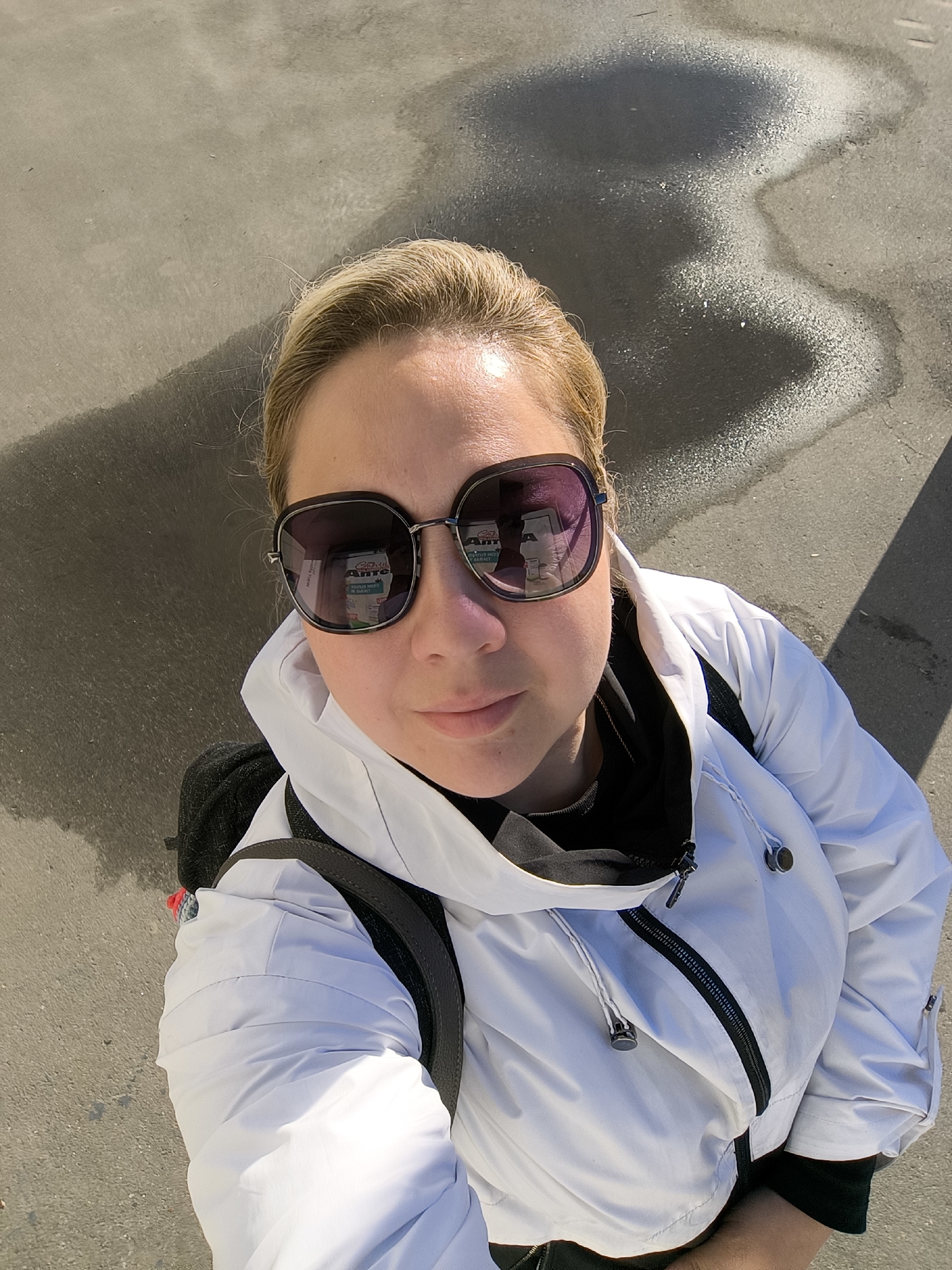 Selfies at a gate decorated with horse murals