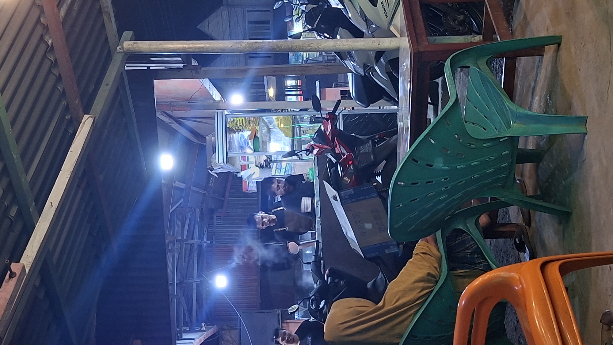 Night at a Keudegeudong warung, neon lights and street life