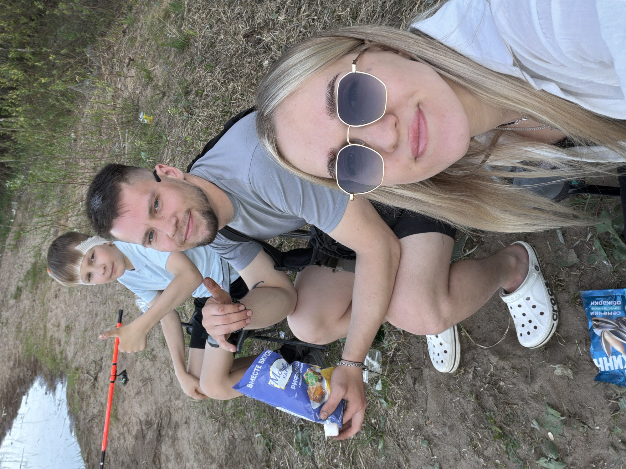 Family fishing trip documented at lakeside location Sunday afternoon